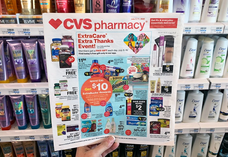 someone holding cvs ad