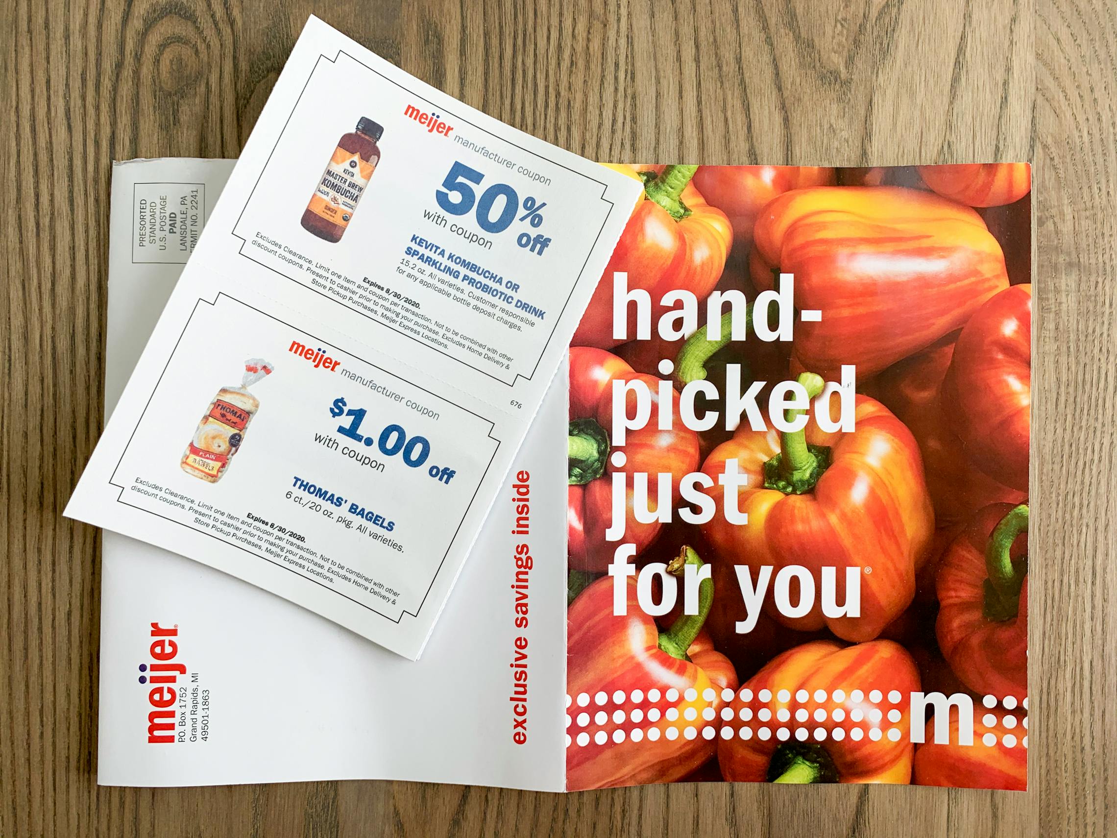 A coupon mailer from Meijer with a coupn for Thomas bagels and a coupon for Kombucha.