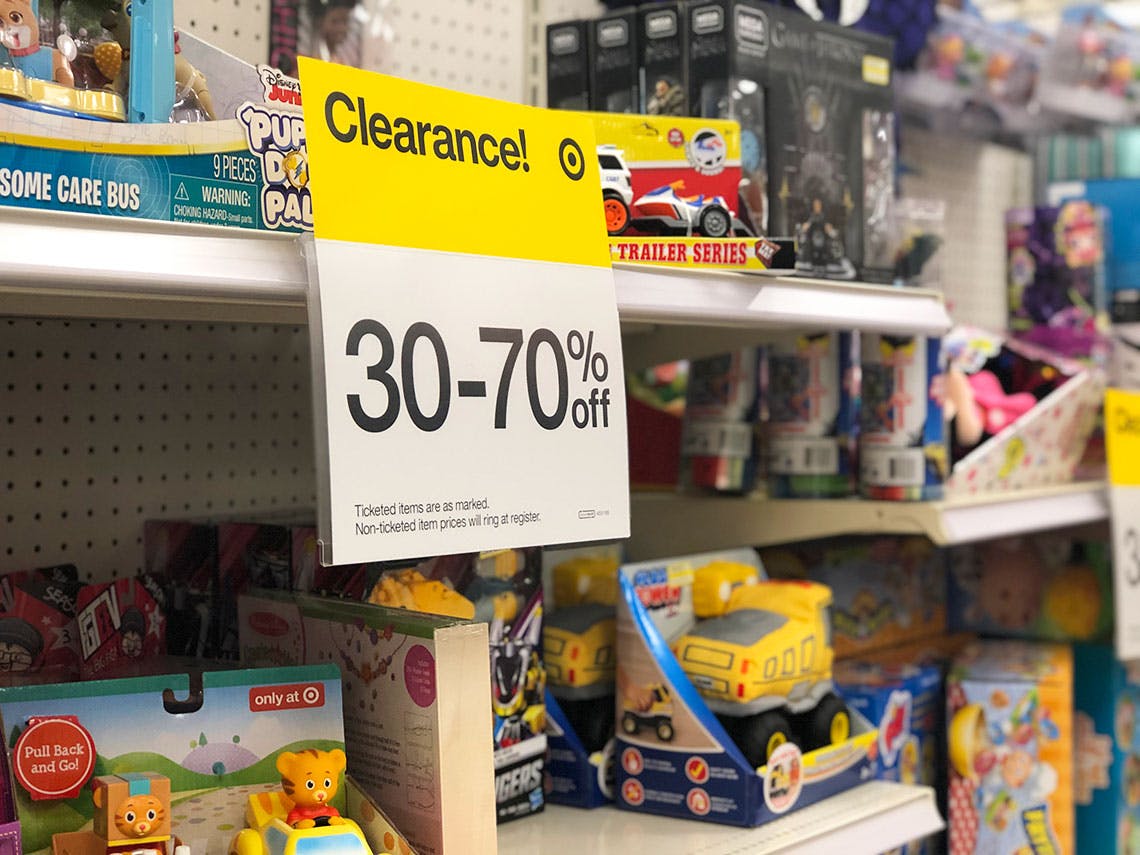 Target toy aisle with a Clearance sticker for 30-70% off attached to a shelf