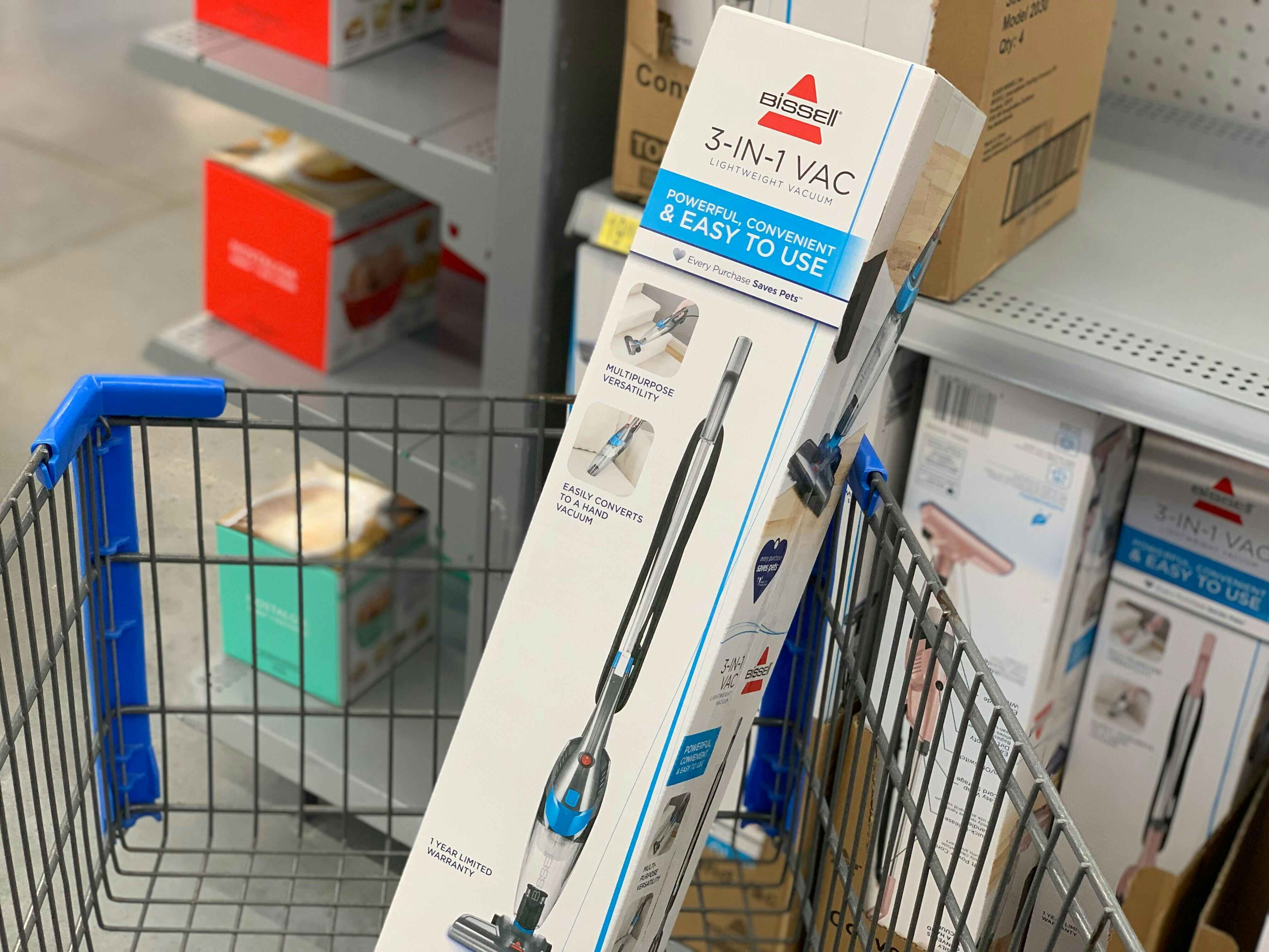 A Bissell 3-in-1 Vacuum in a Walmart shopping cart.