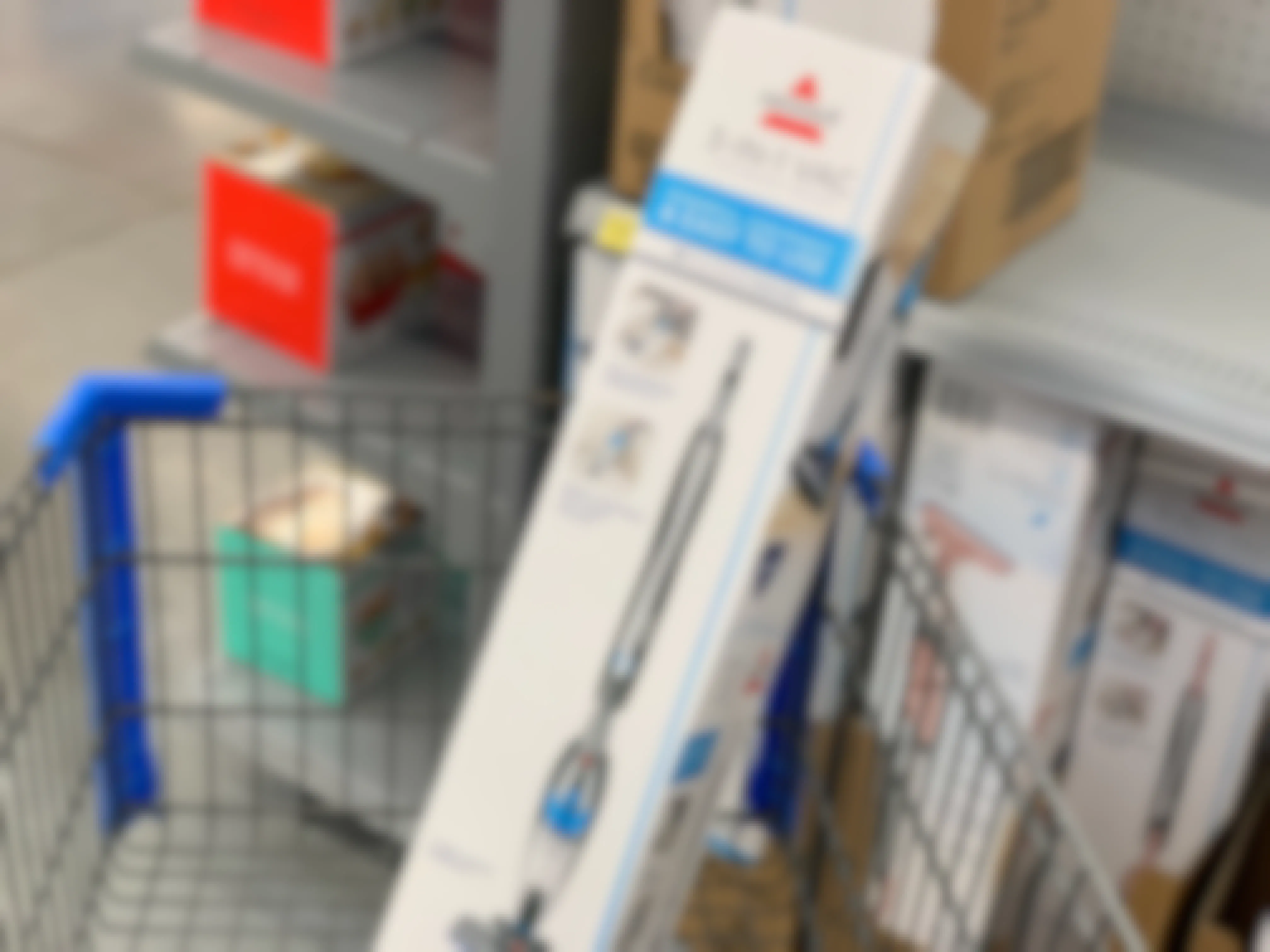 A Bissell 3-in-1 Vacuum in a Walmart shopping cart.
