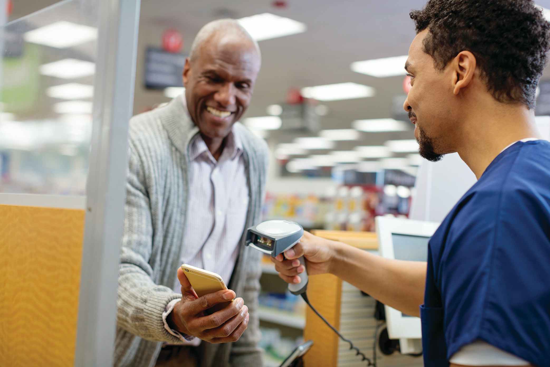 cvs pharmacist scans customer's app at the register