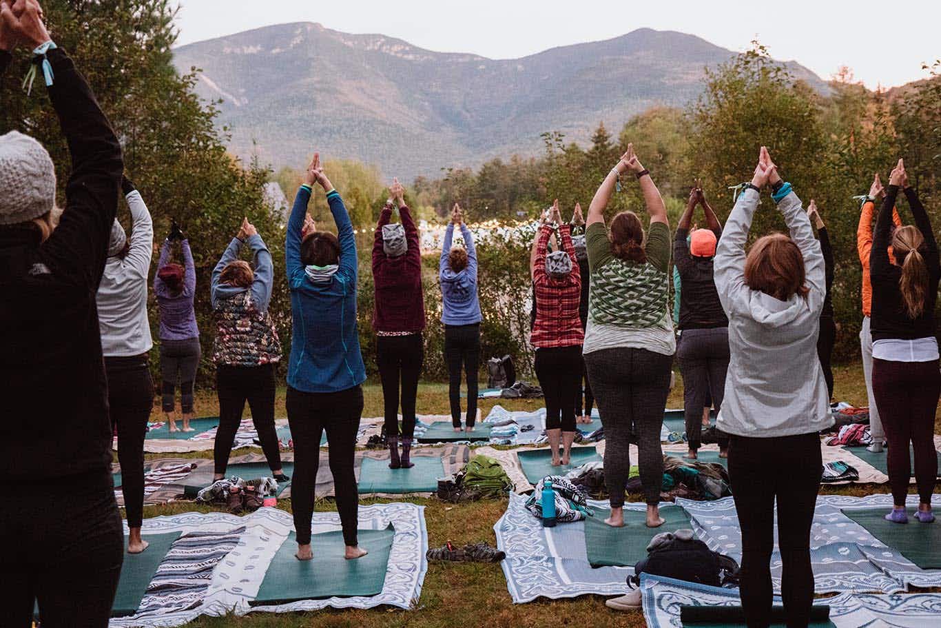 group of people take a free yoga class at REI