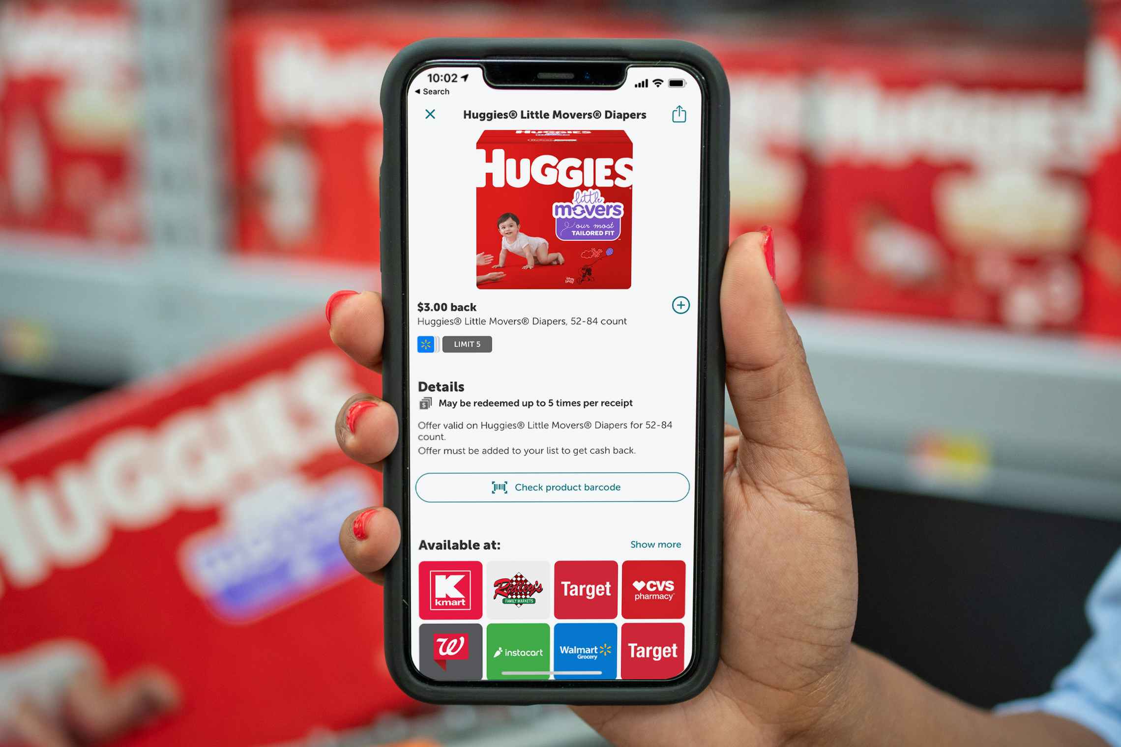 Ibotta app on a cell phone featuring a huggies diaper rebate. 