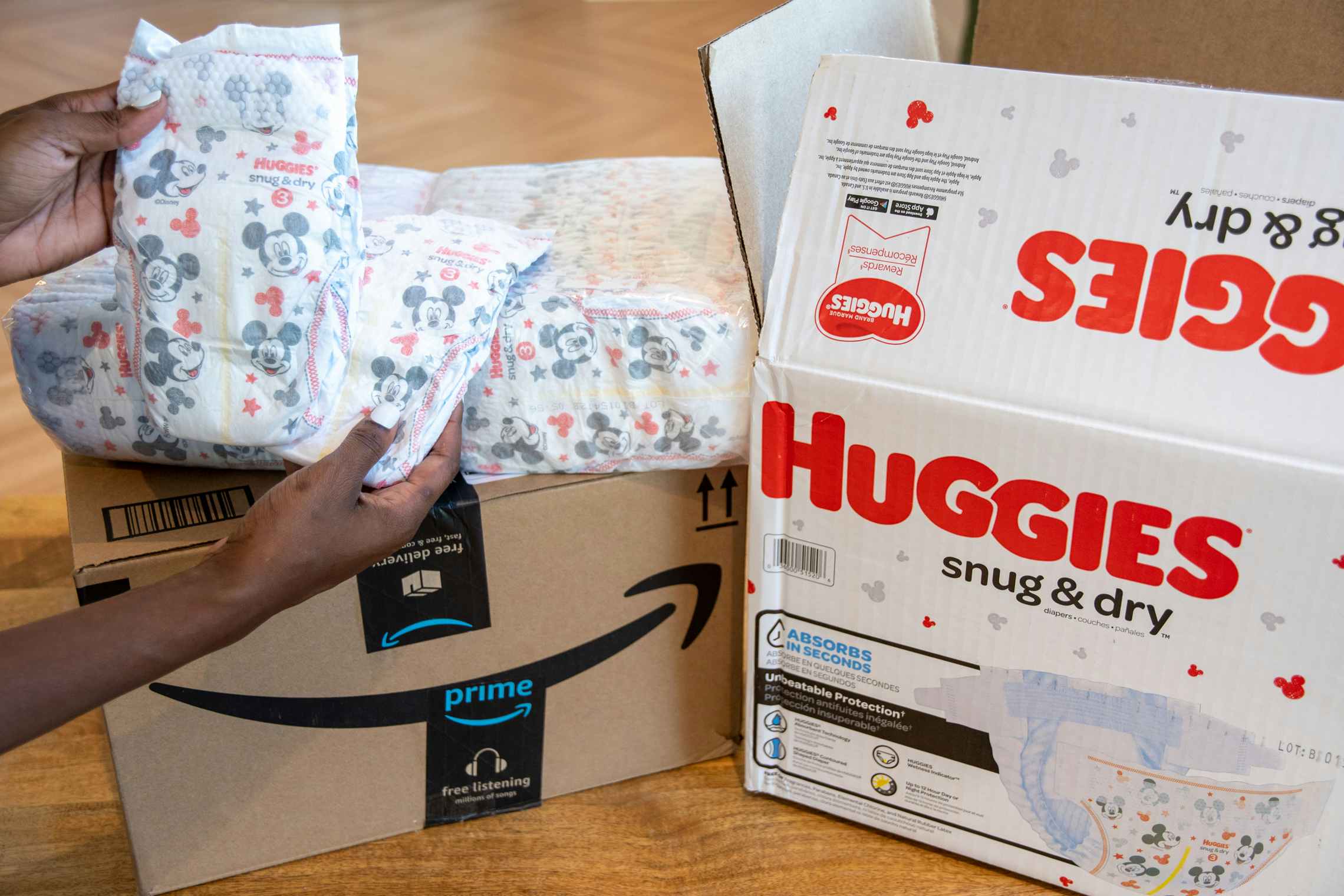 Huggies diapers next to an Amazon box.