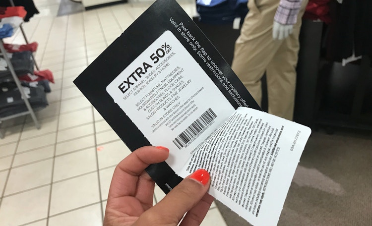 Someone holding a coupon inside JCPenney