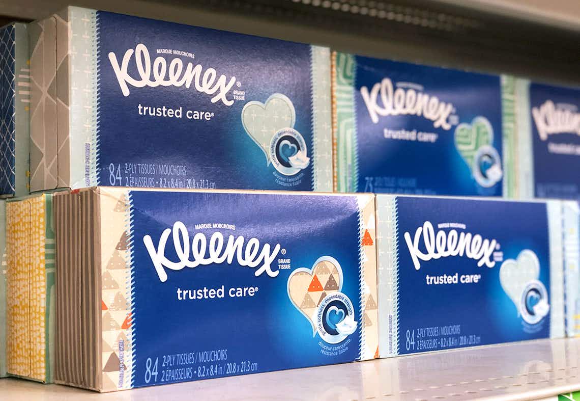 Boxes of Kleenex stocked on a shelf.