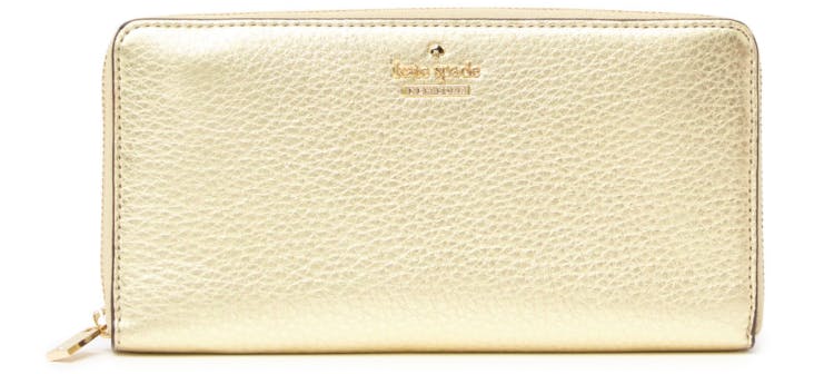 The gold-colored Kate Spade Blake Street Dot Lacey leather wallet.