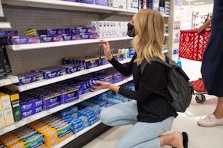 woman shopping for toothpaste