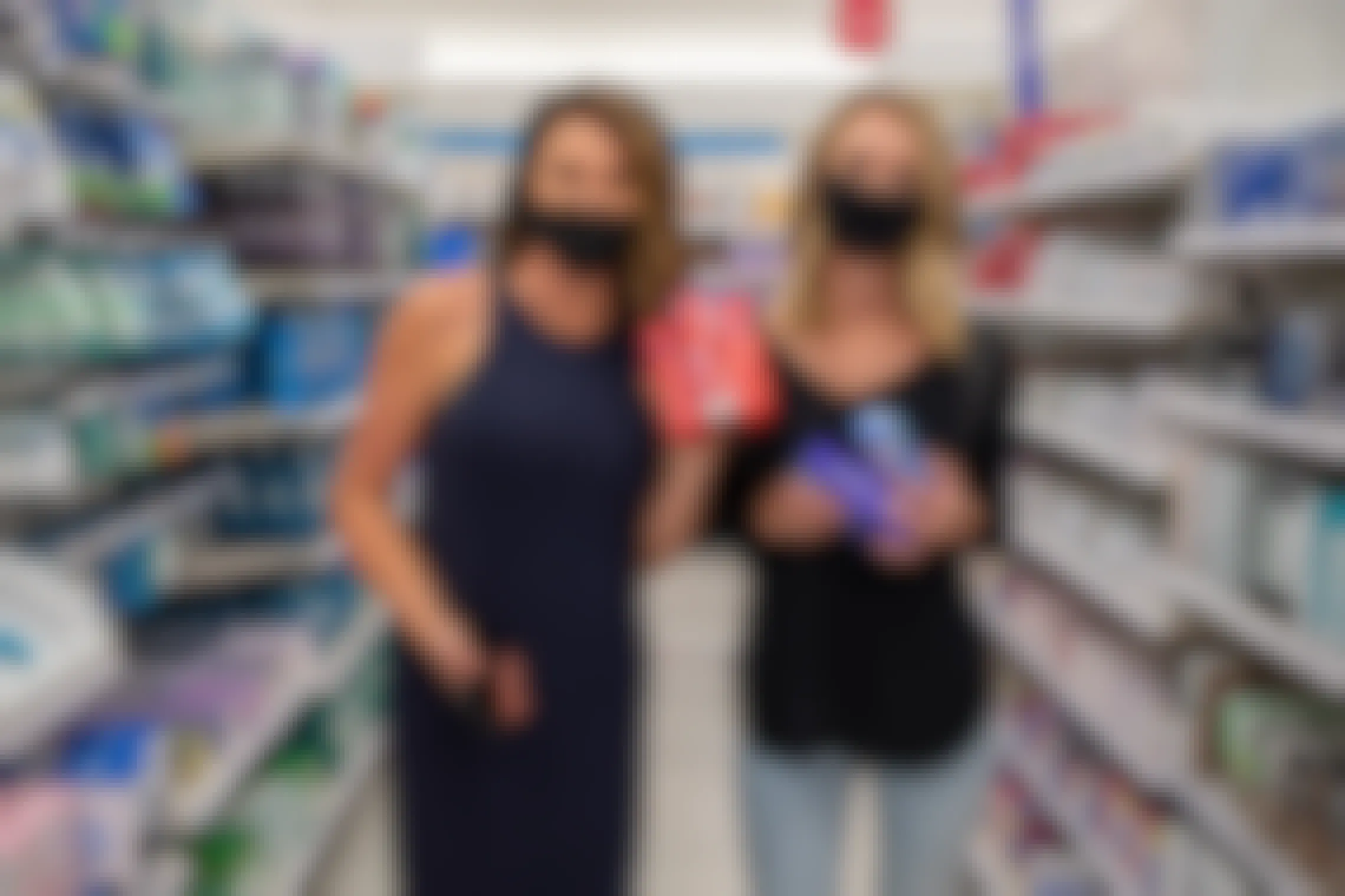 two women wear masks in target while shopping