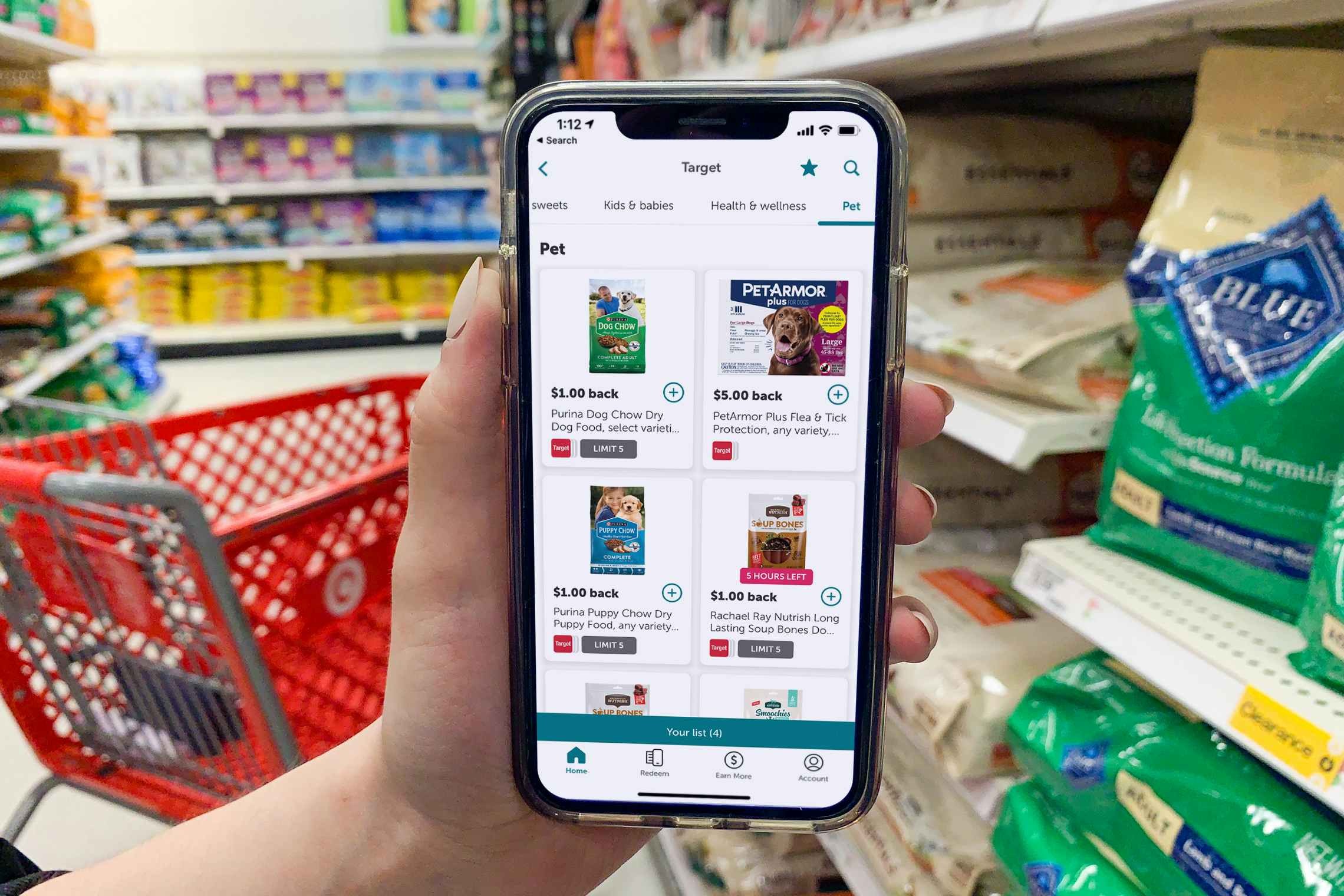 Ibotta app on a cell phone in the pet food section at Target.