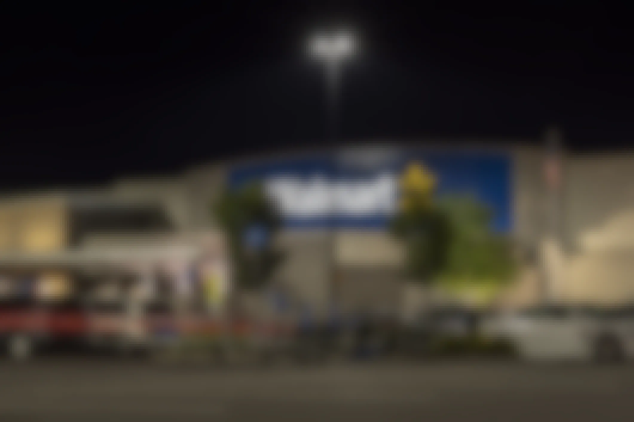 A Walmart storefront at nightime.