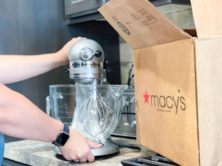 kitchen aid being put next to macy box