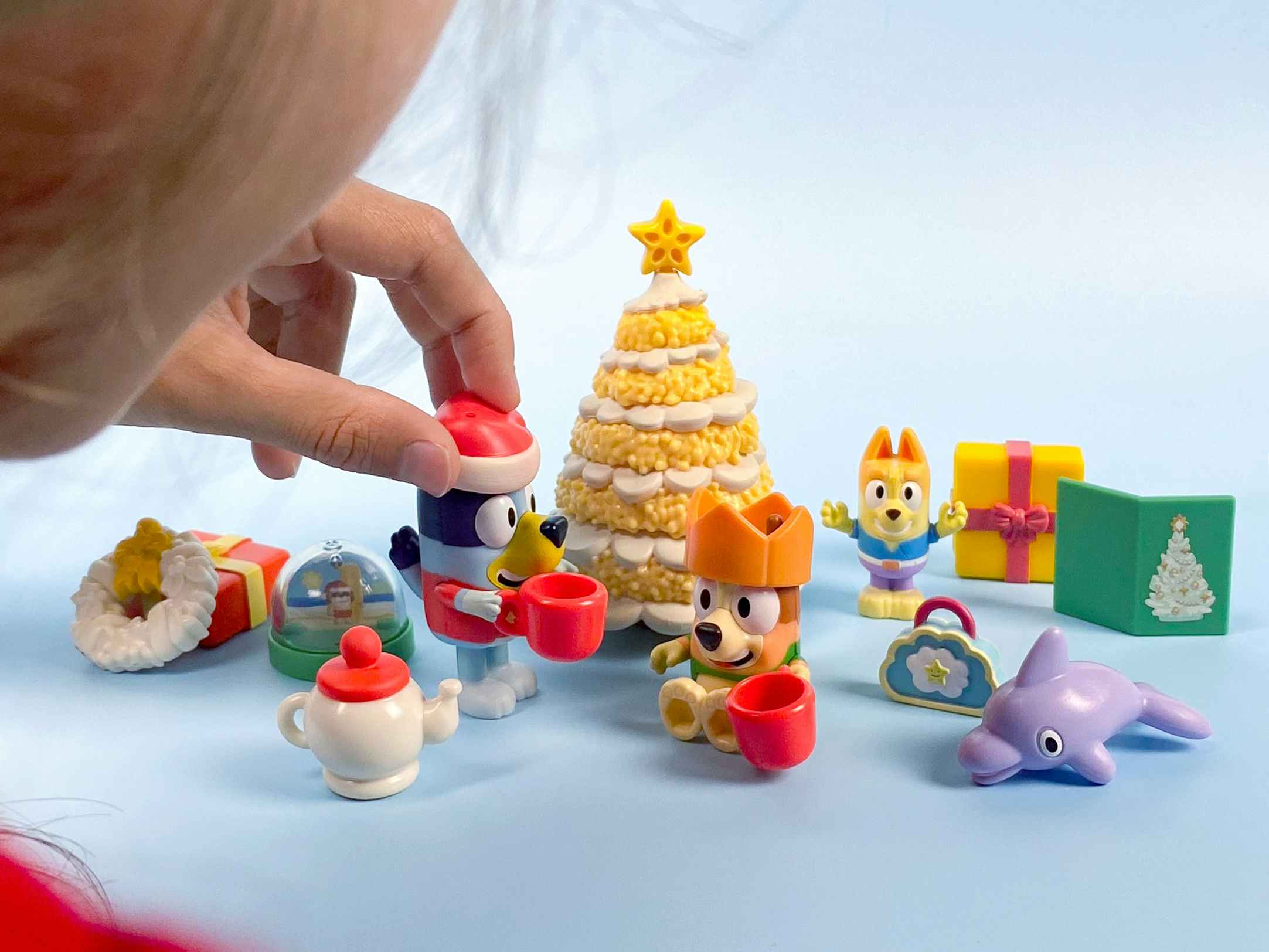 child playing with bluey's classic christmas exclusive advent calendar