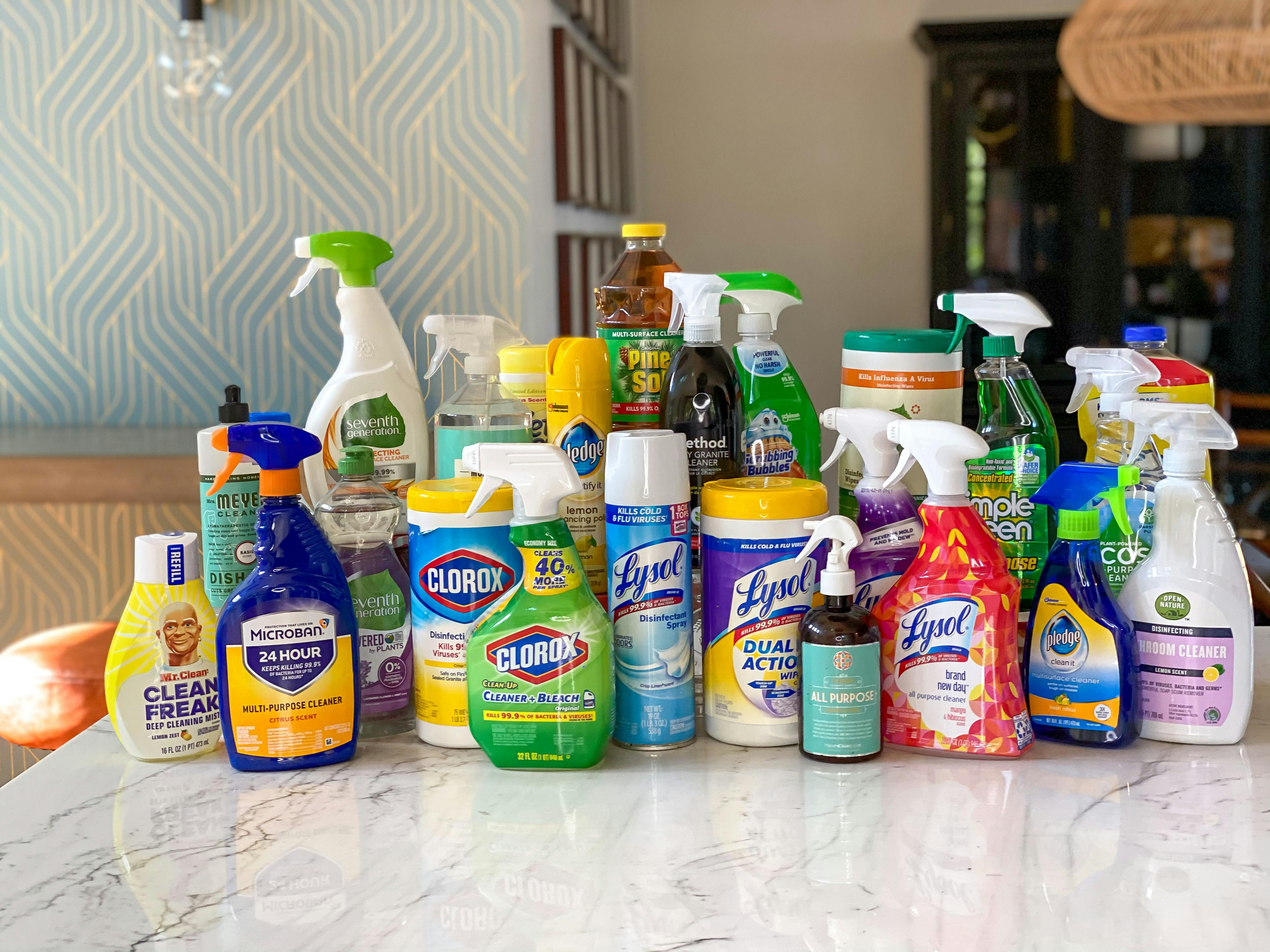 A table with a lot of cleaning products 