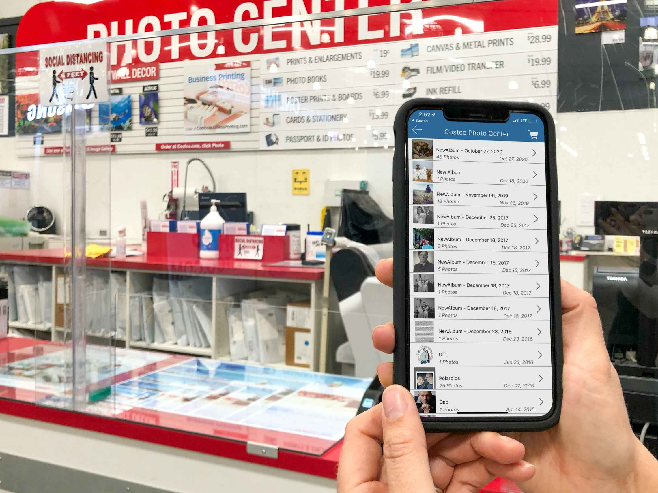 Costco photo app on a cell phone at Costcos photo center.