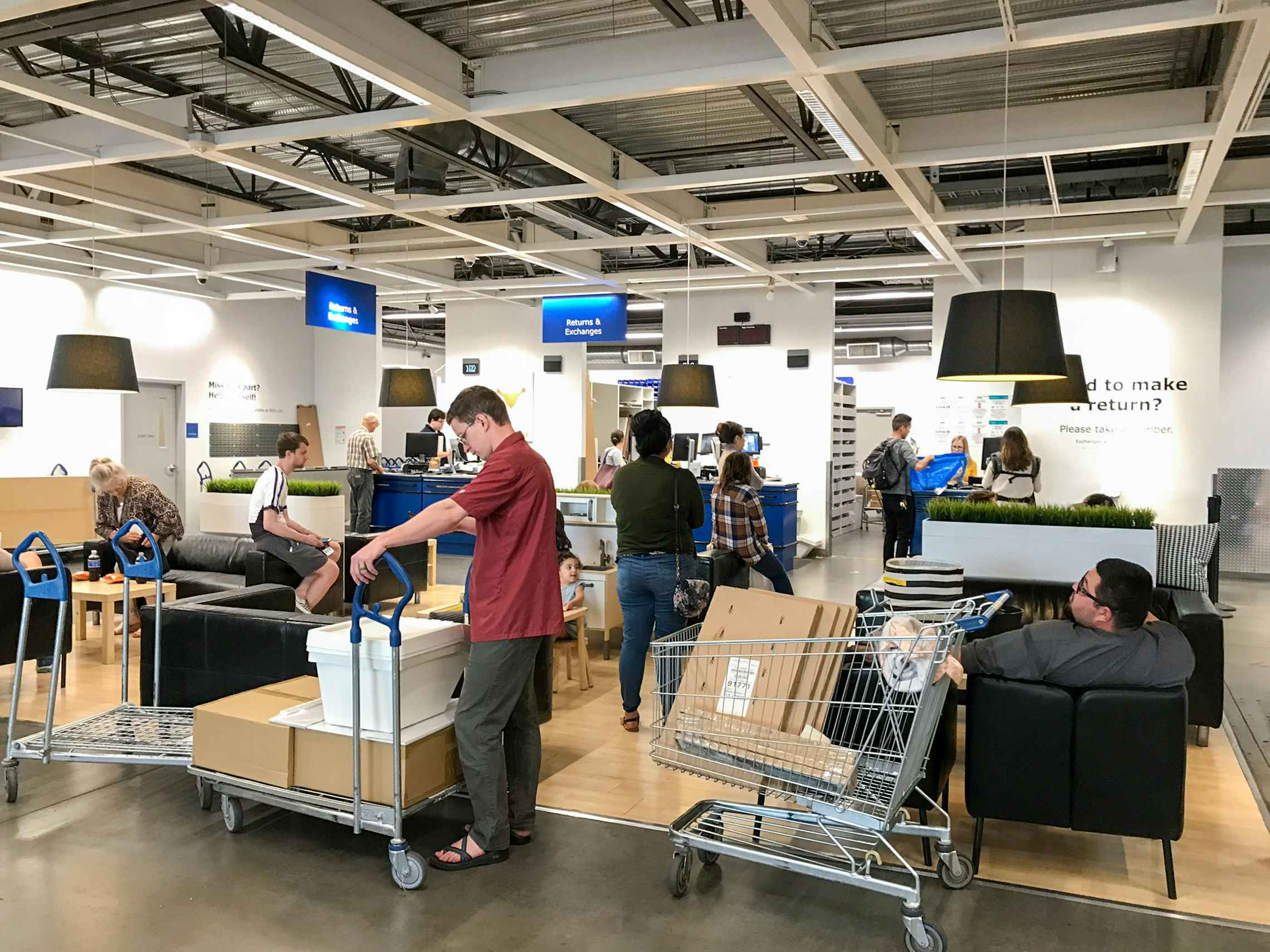 People waiting in line at the Ikea Returns & Exchanges counter