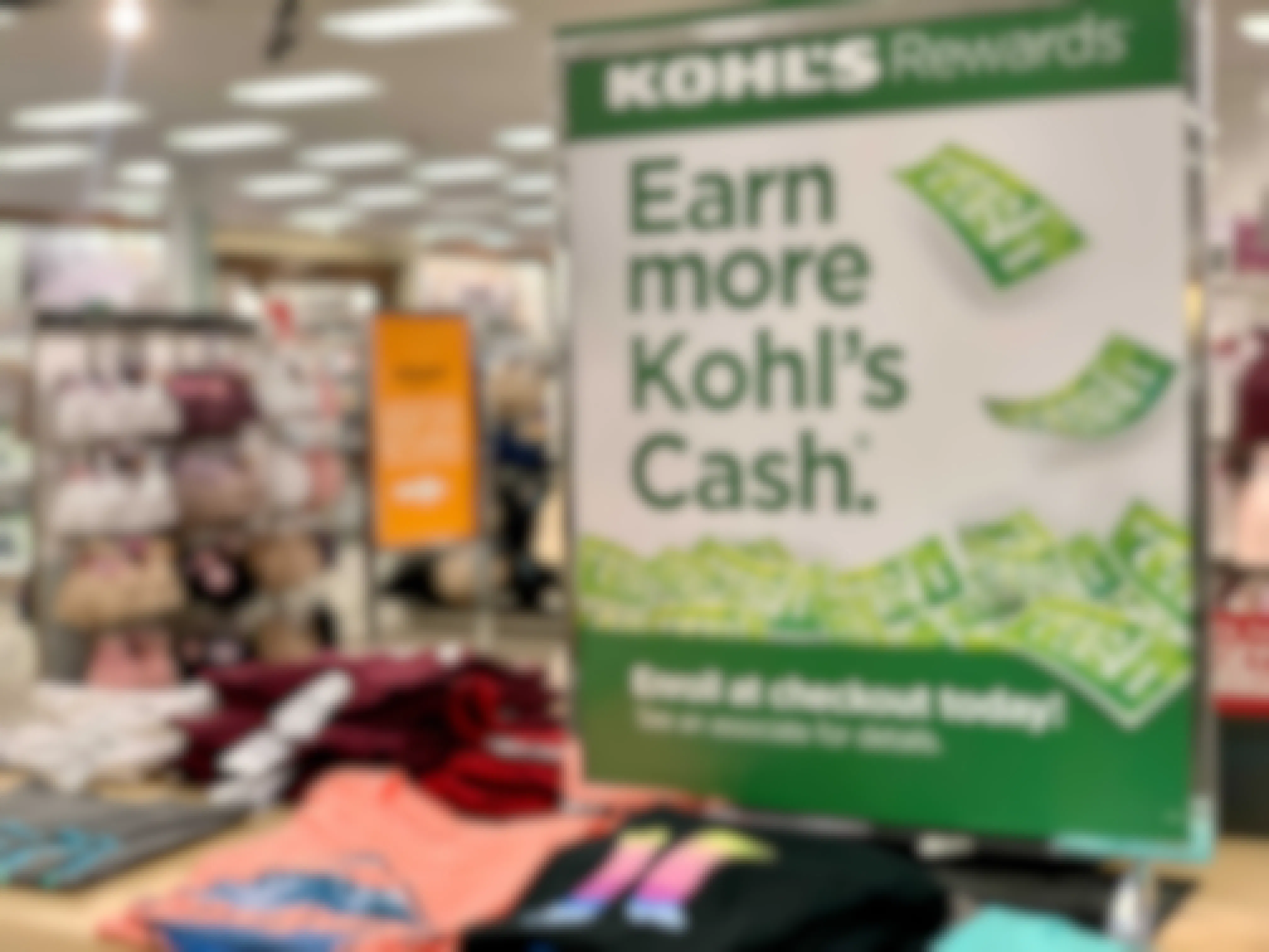 Kohls rewards earn more kohls cash sign in store on tee shirt display stand