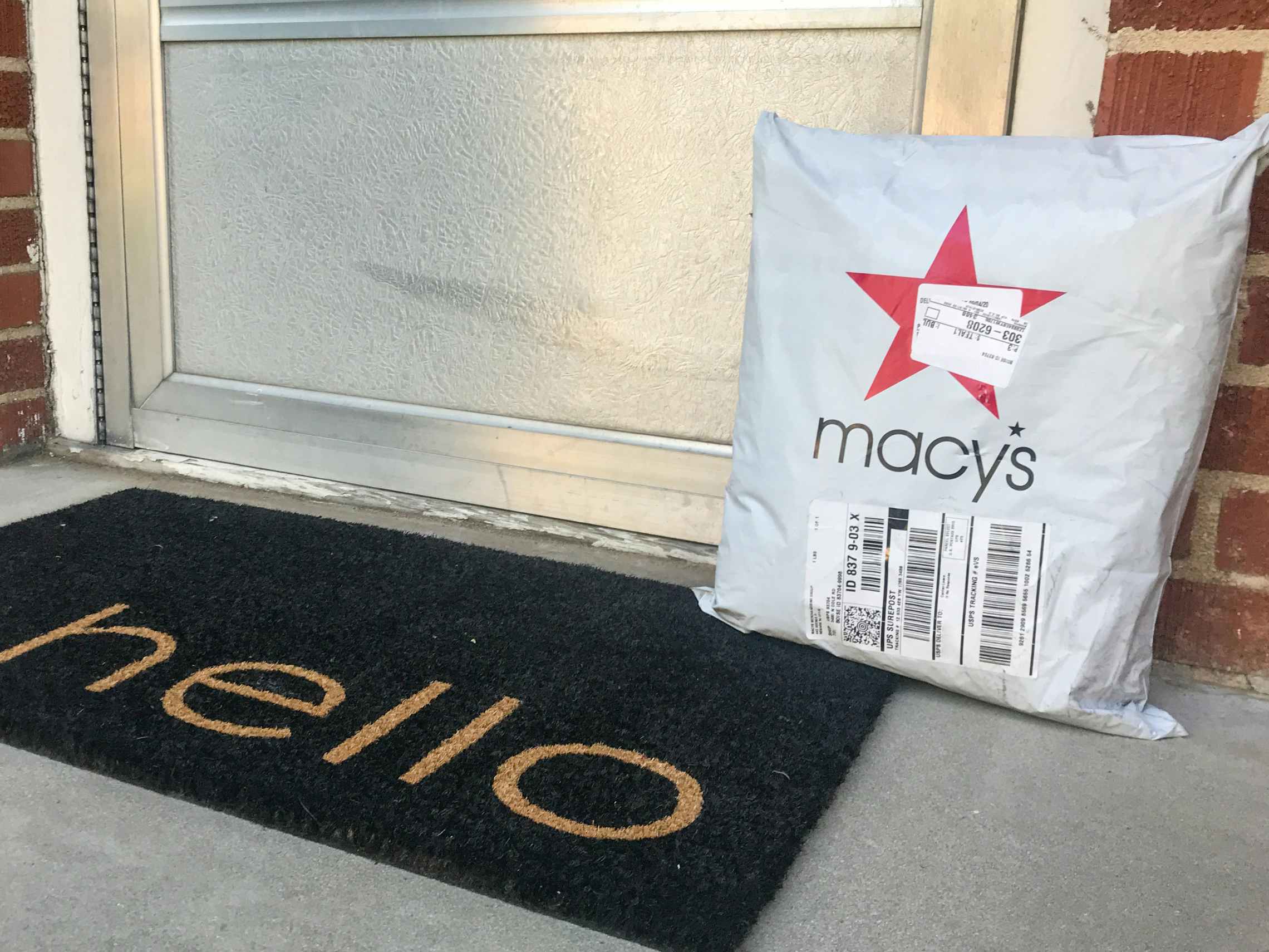 Macys.com online order package on a doorstep