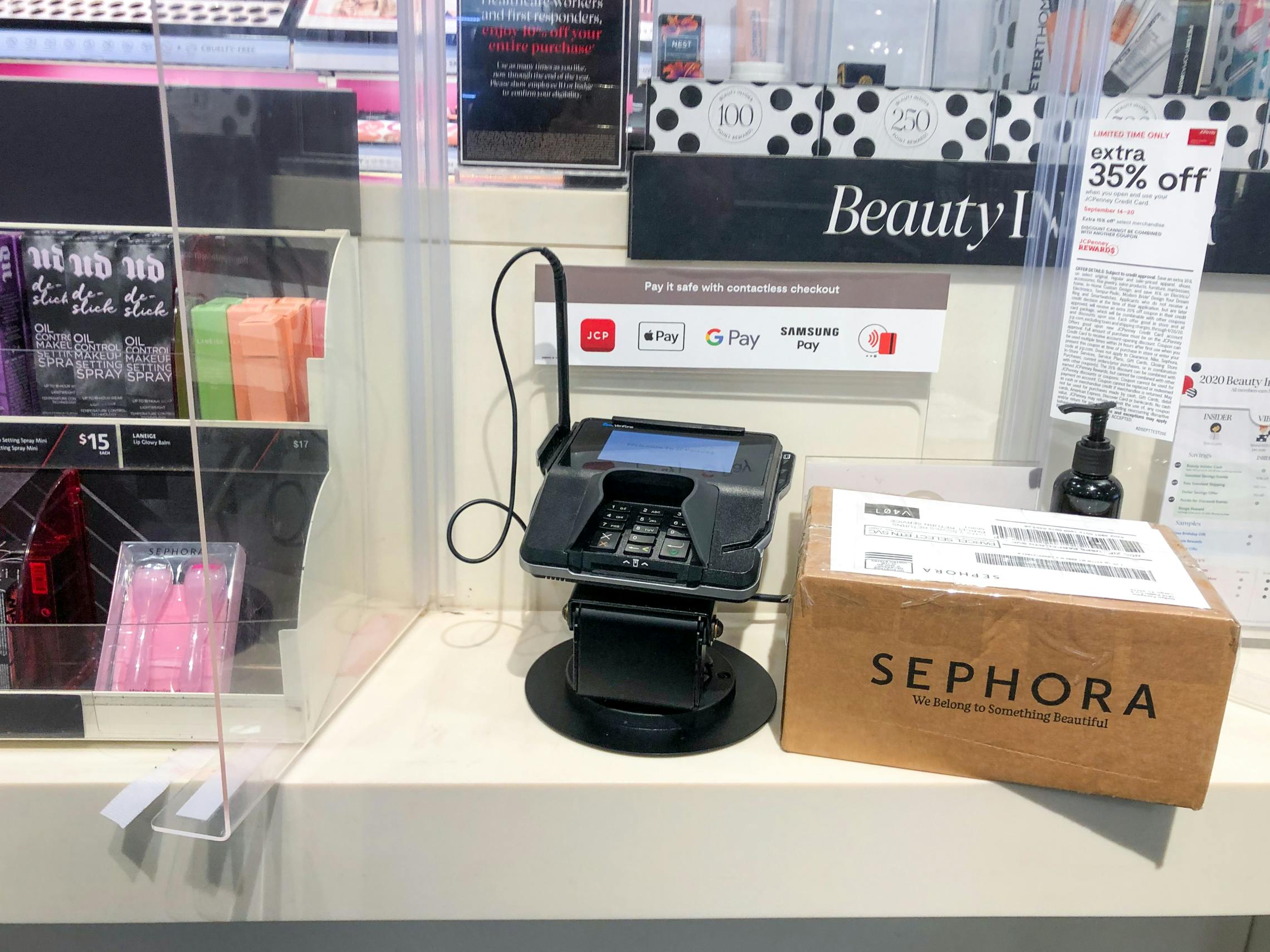 Return shipping box sitting on the counter near a register at Sephora
