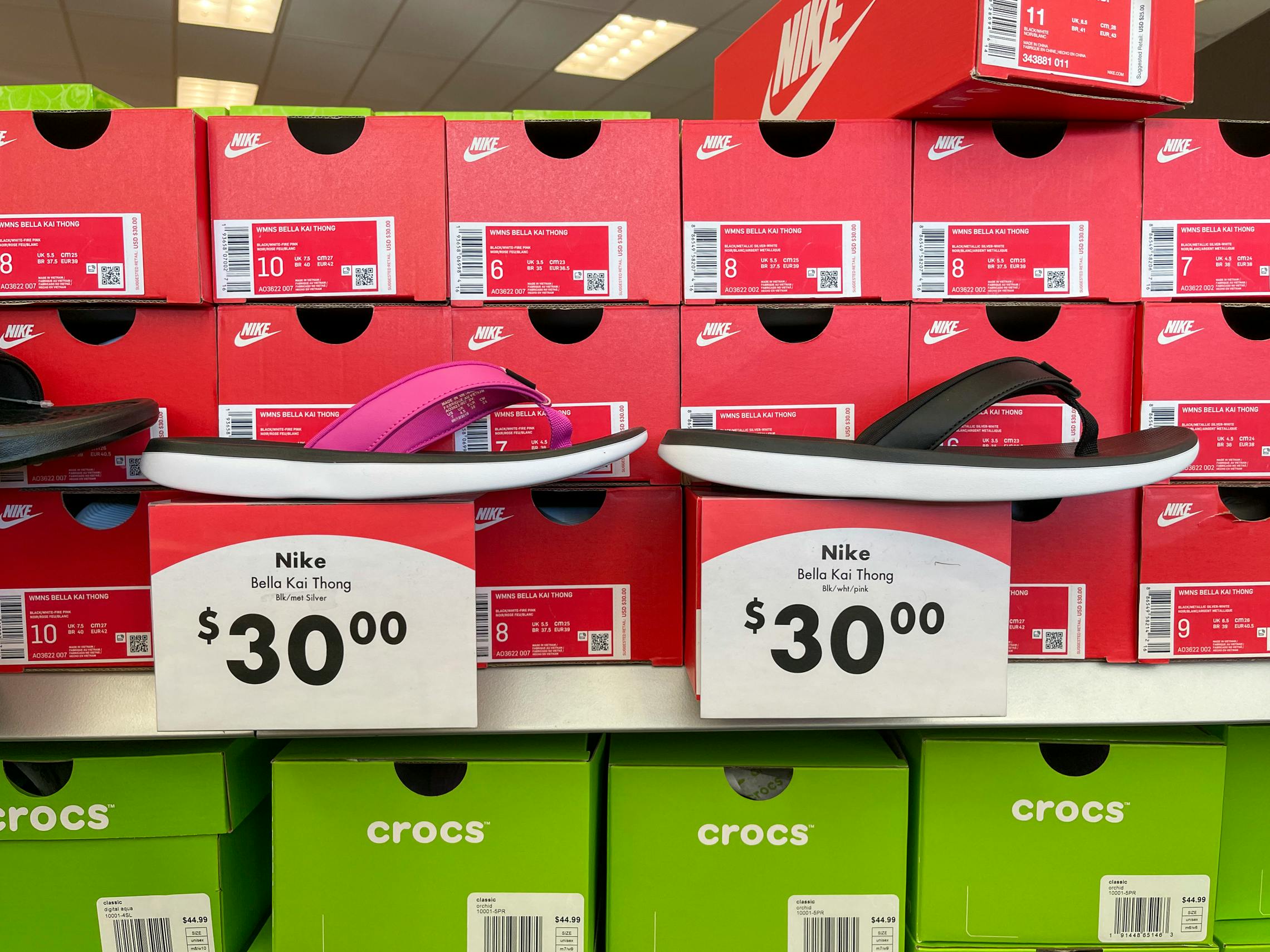 Nikes shoes with large red and white price tags reading $30.