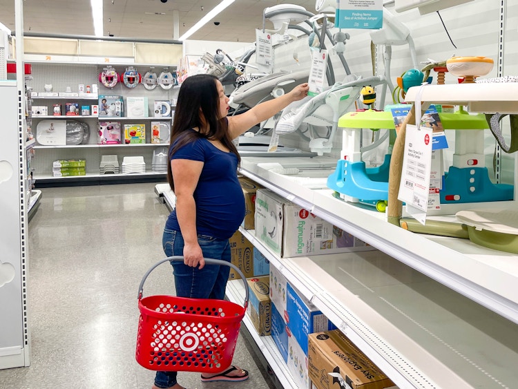 a woman shopping for baby items in target