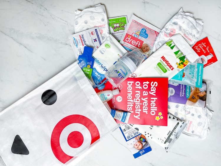 a target baby registry welcome bag with the contents layed out on a counter