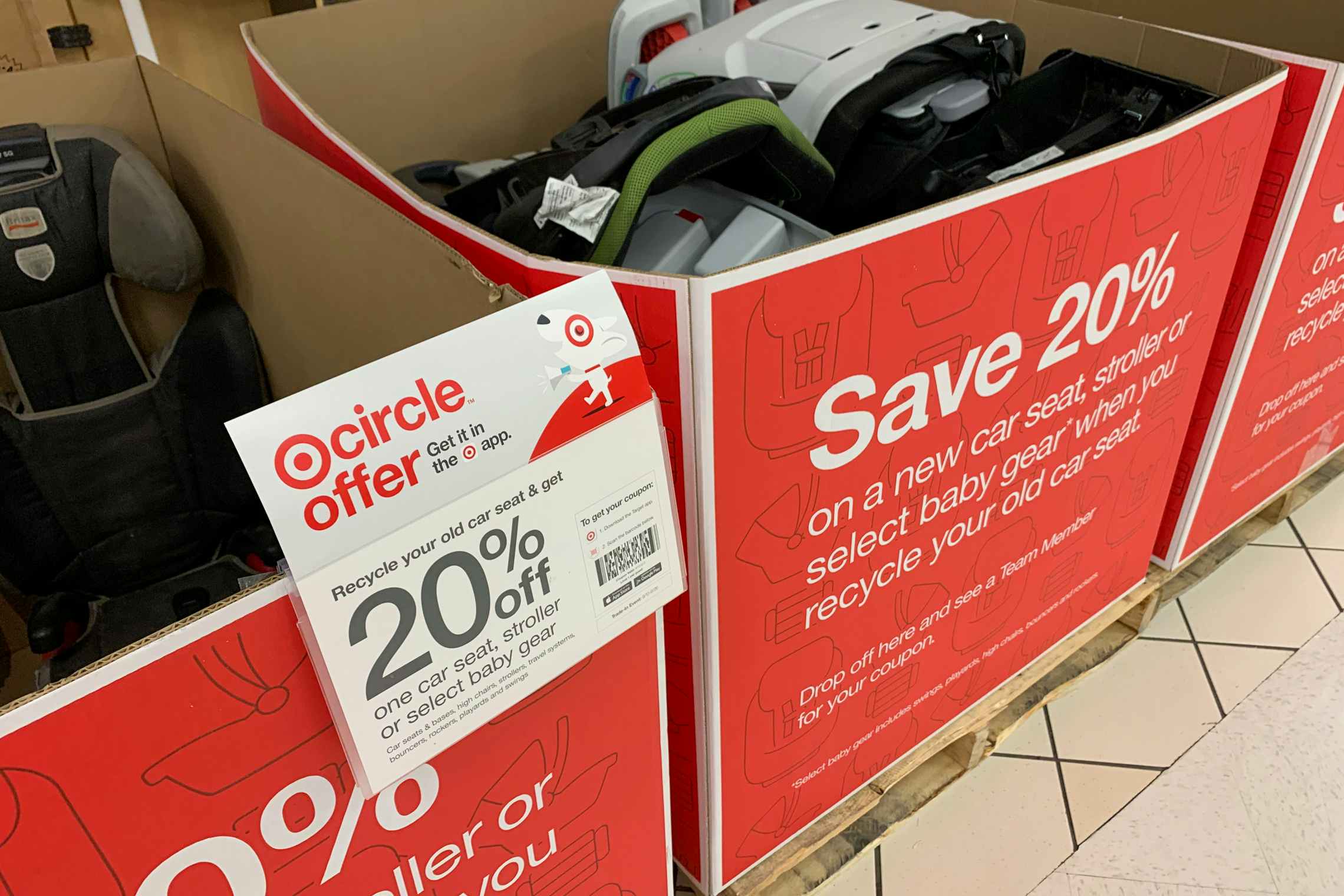 A bin filled with car seats inside Target.