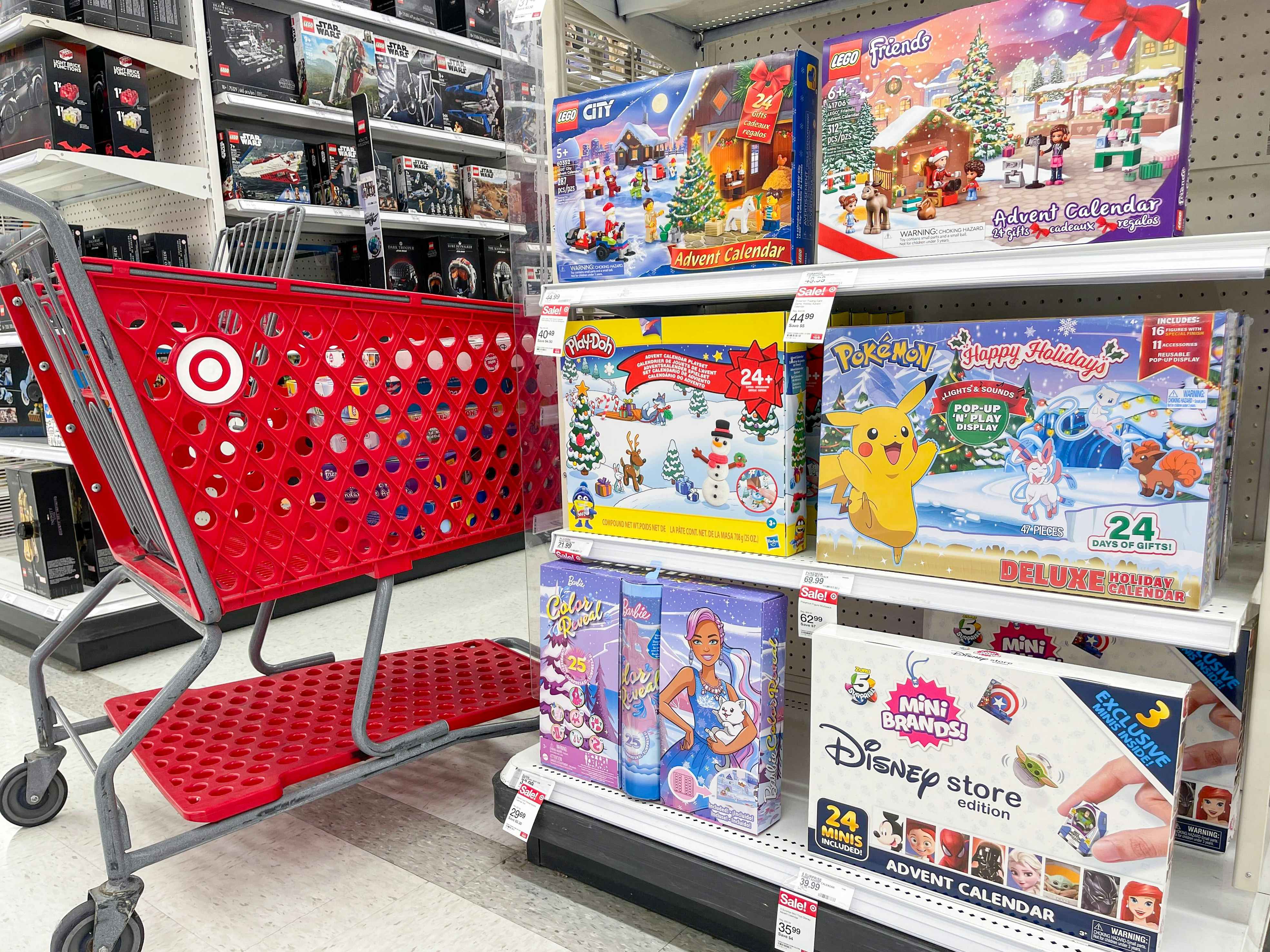 A Target shopping cart parked next to a display of holiday advent calendars at Target.