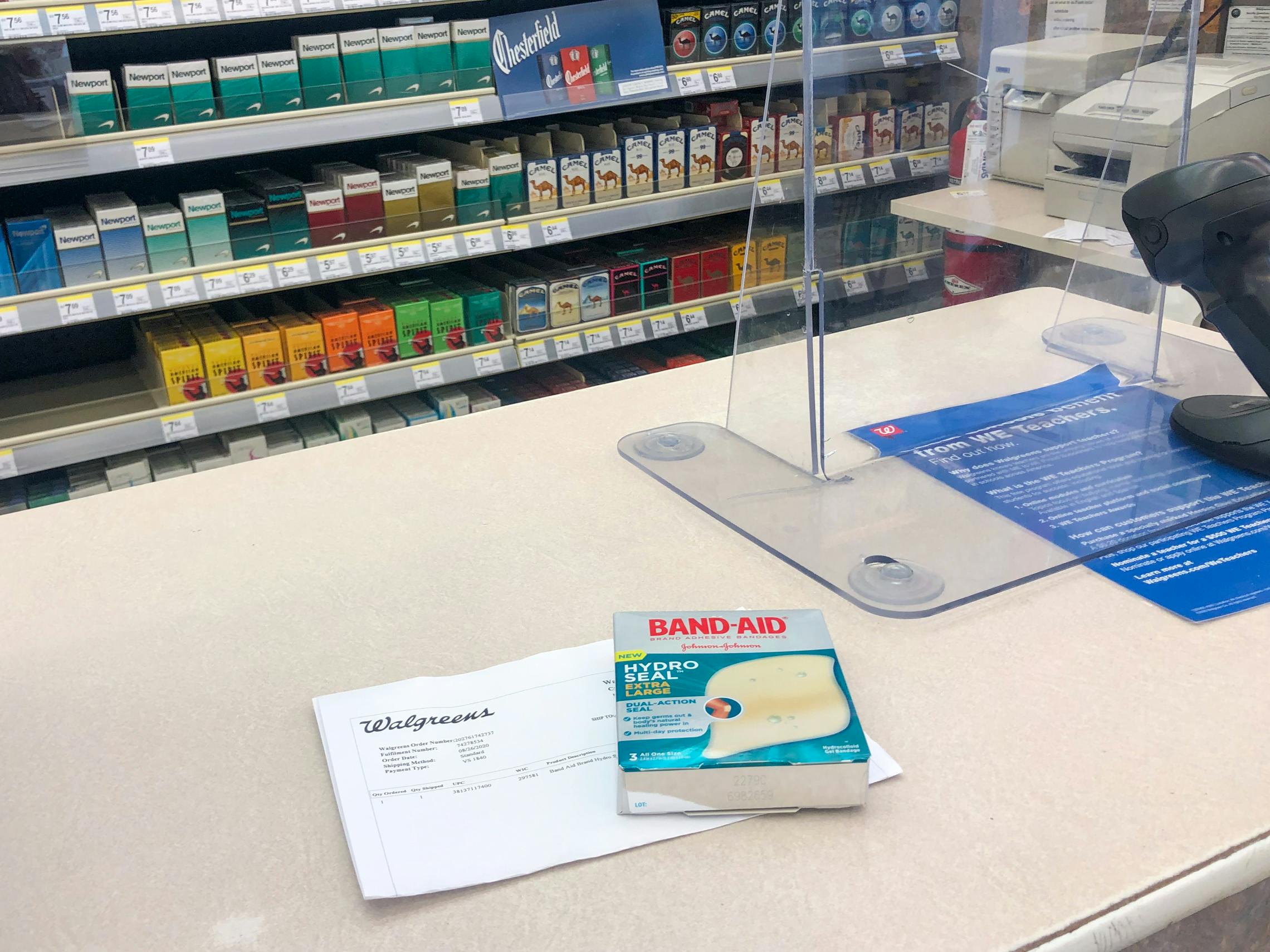 Band-aids sitting on a checkout counter with an online receipt