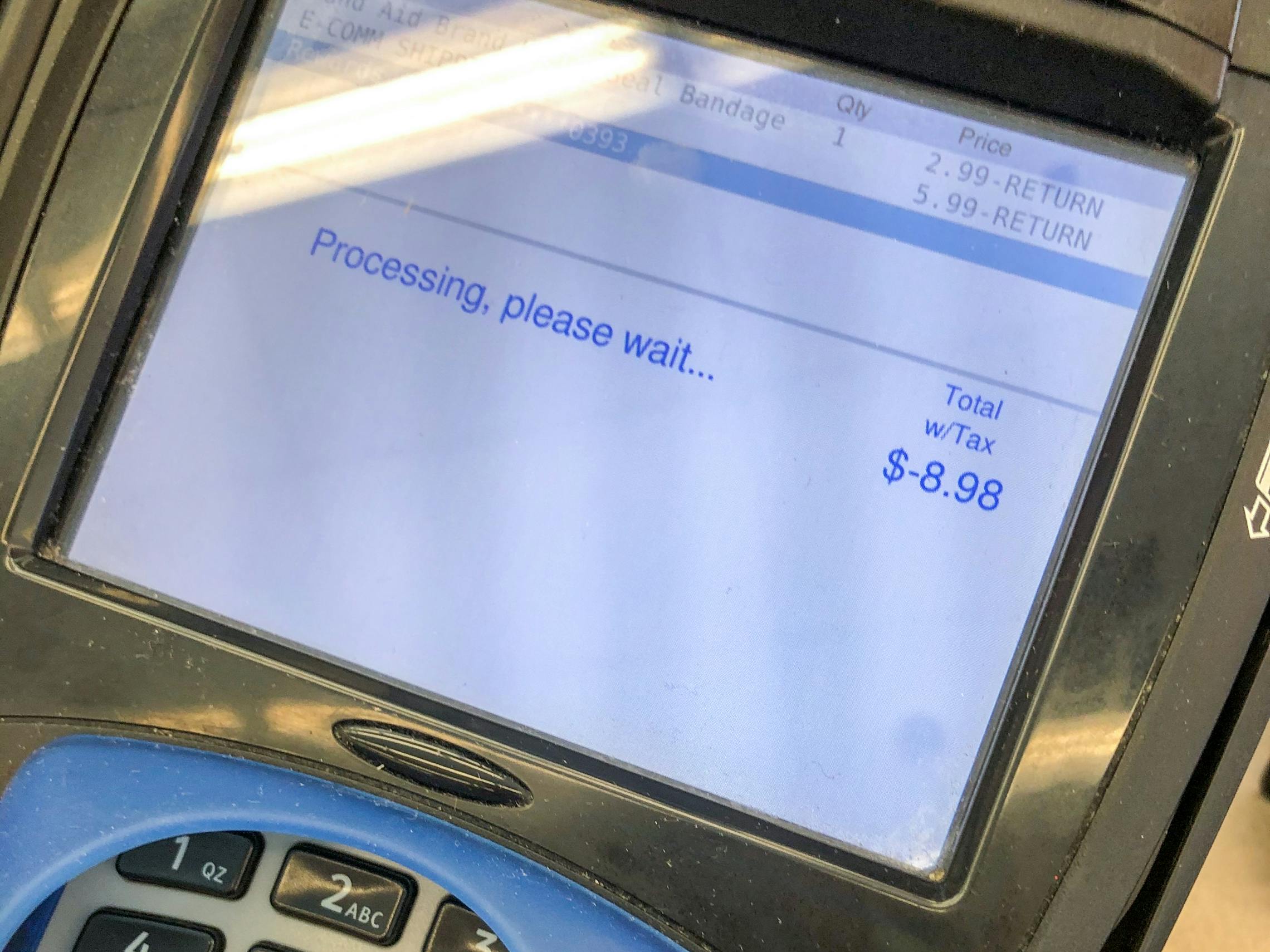 A return showing on the screen at a Walgreen checkout
