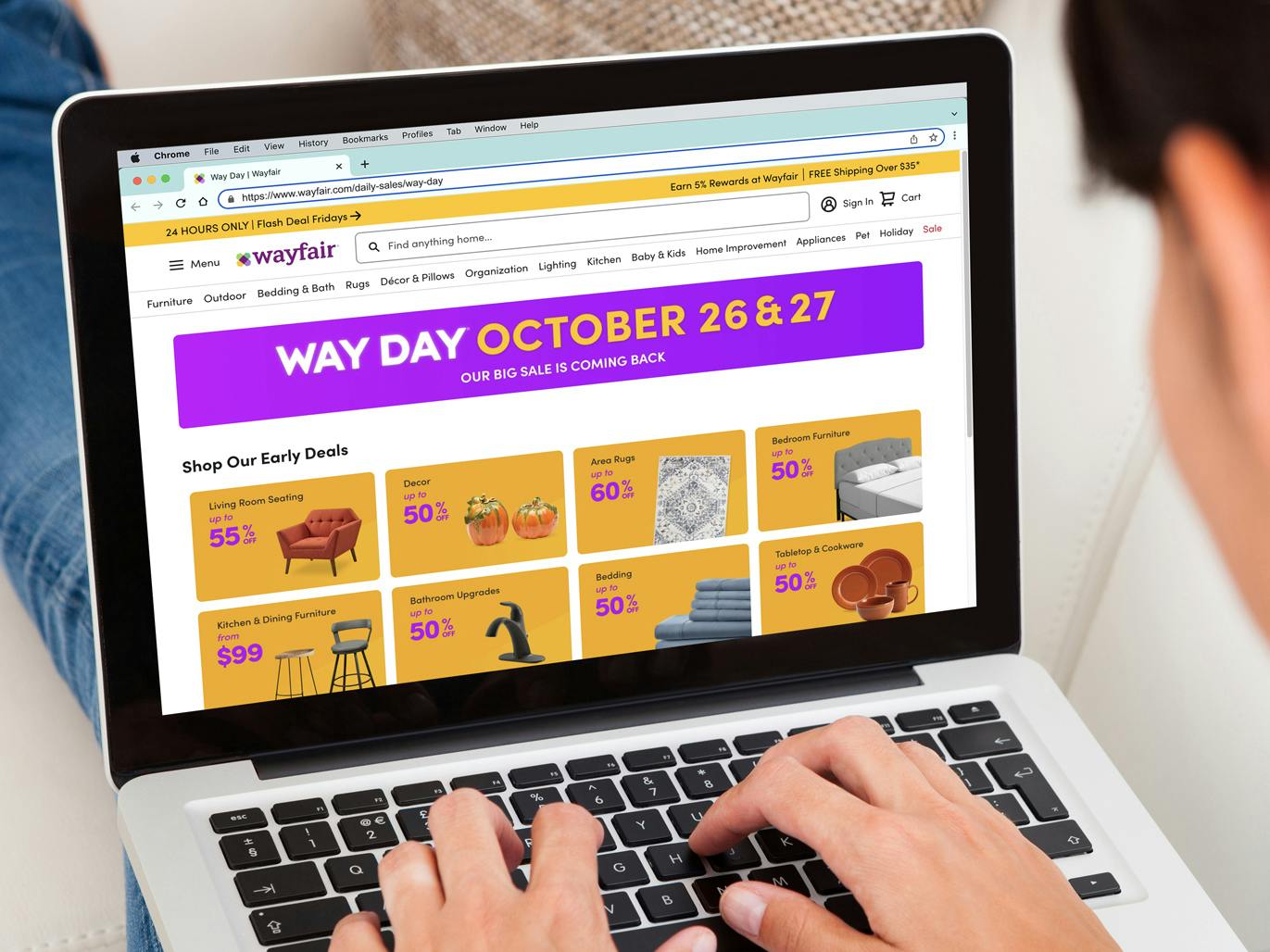 person shopping the wayfair way day sale on laptop