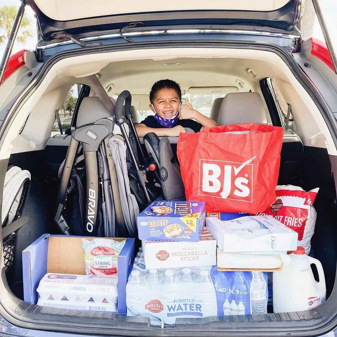 A car full of items from BJ's wholesale club.