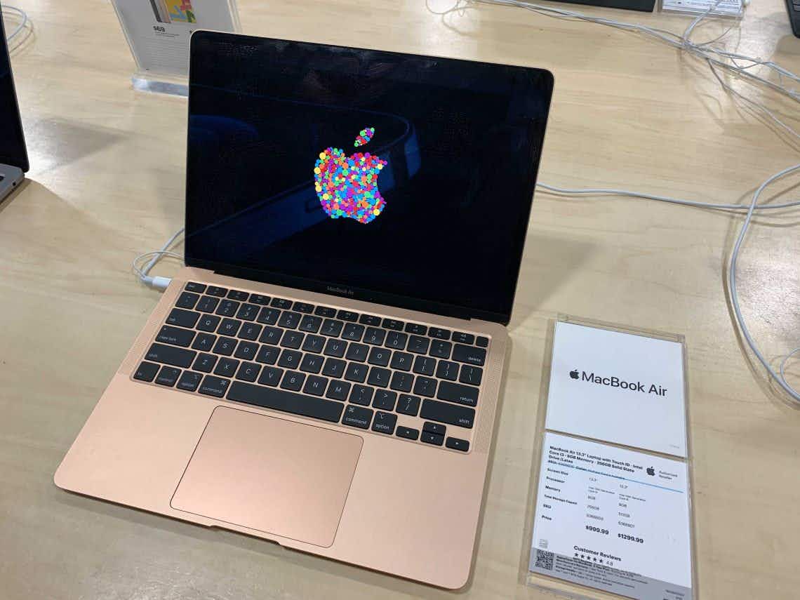 A rose gold MacBook Air on display at Best Buy.