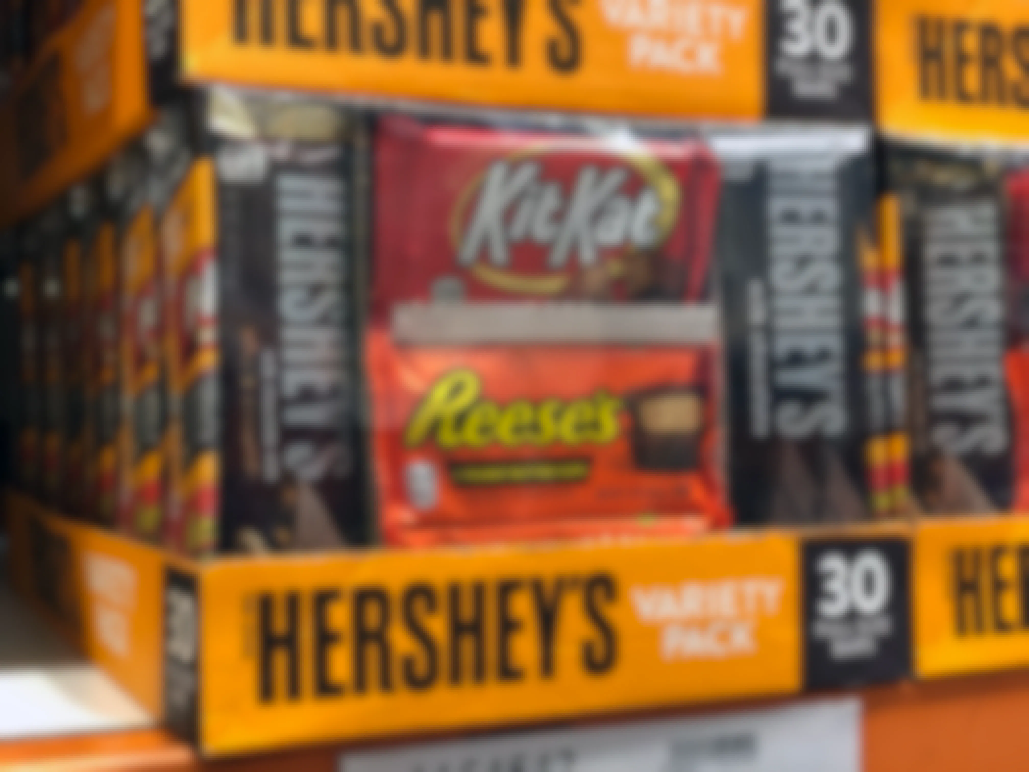 Full size candy bar packs stocked on a Costco shelf.