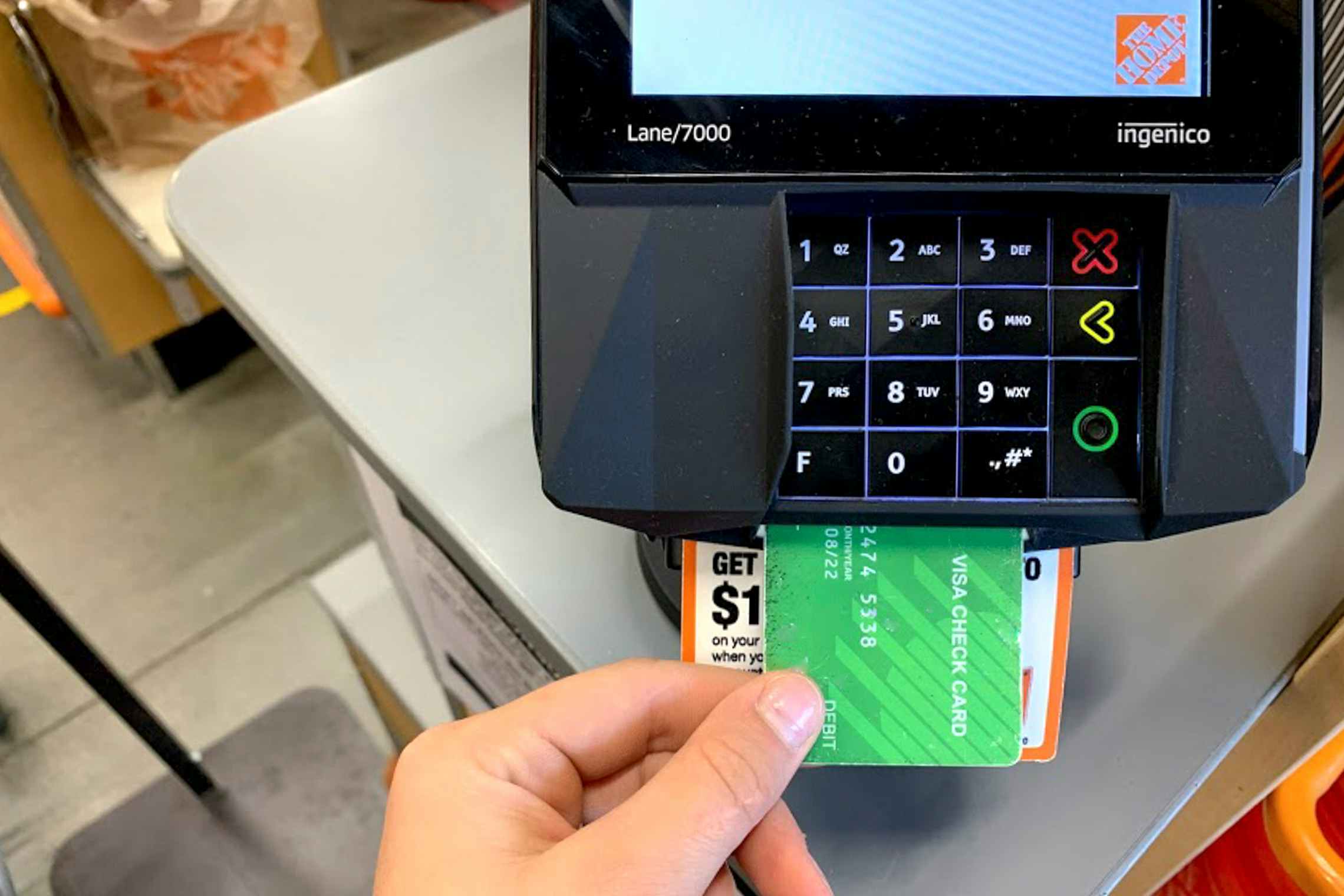 Someone using their credit card at check out