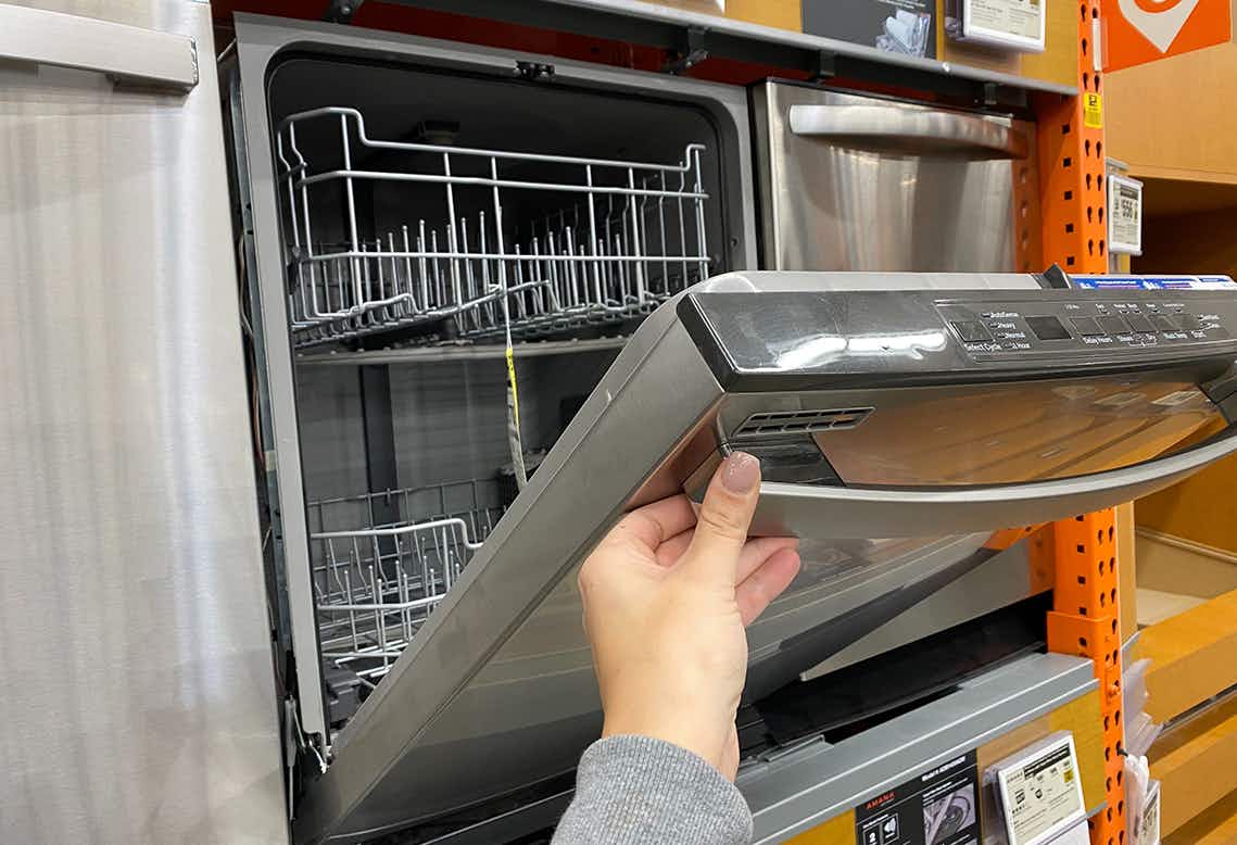 Someone shopping for a dishwasher at Home Depot