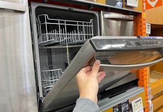 Someone shopping for a dishwasher at Home Depot