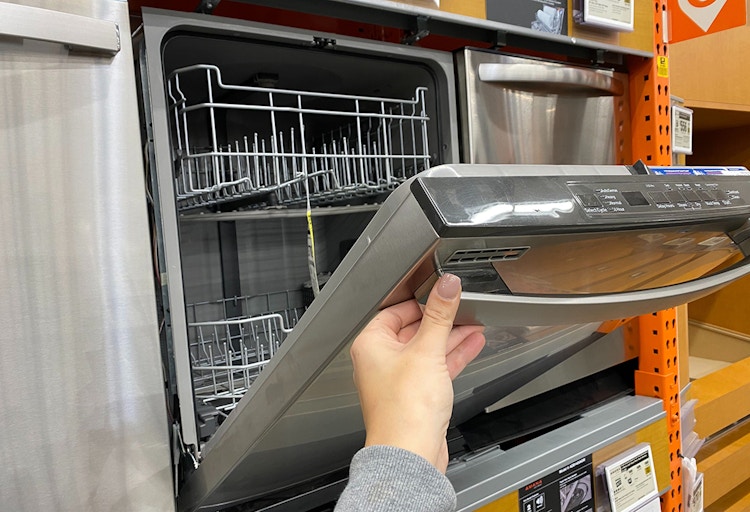 Someone shopping for a dishwasher at Home Depot