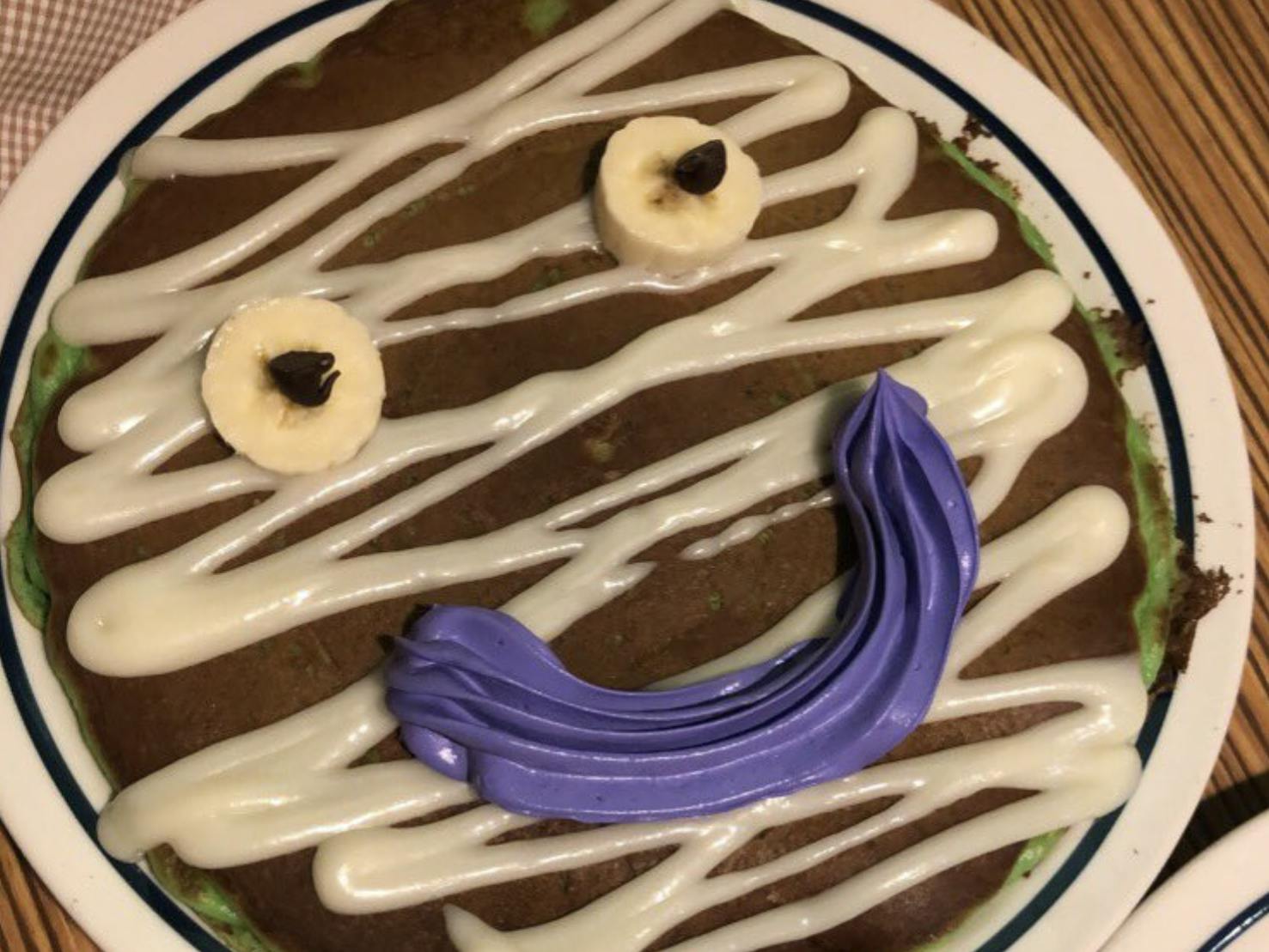 A close-up of a Mr. Mummy pancake from IHOP.