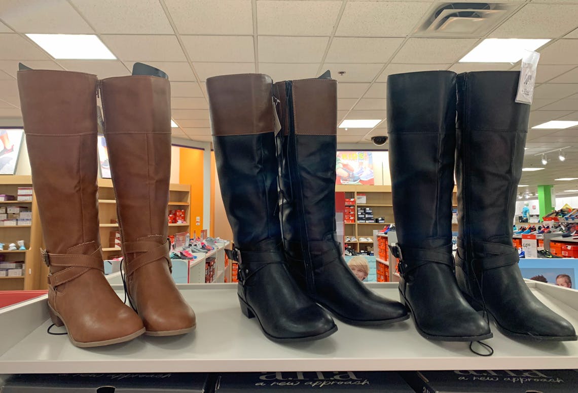 Three pairs of women's boots displayed on a shelf at JCPenney.