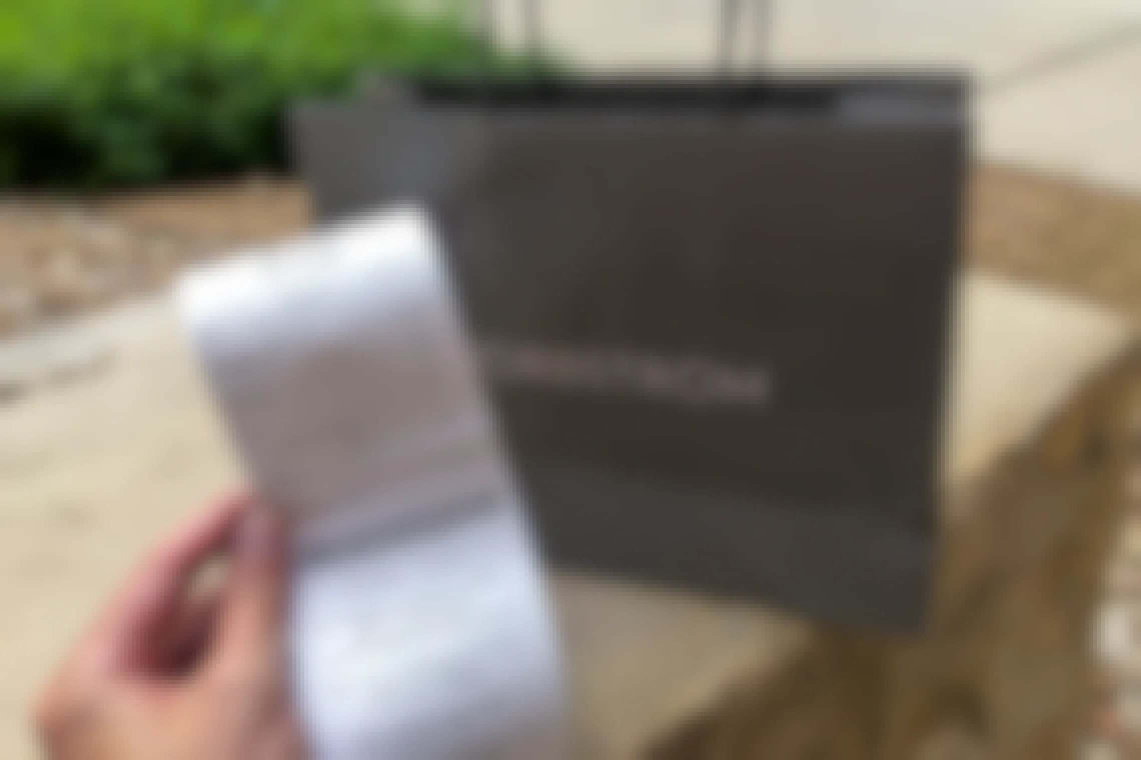 Nordstrom receipt held up in front of a bag