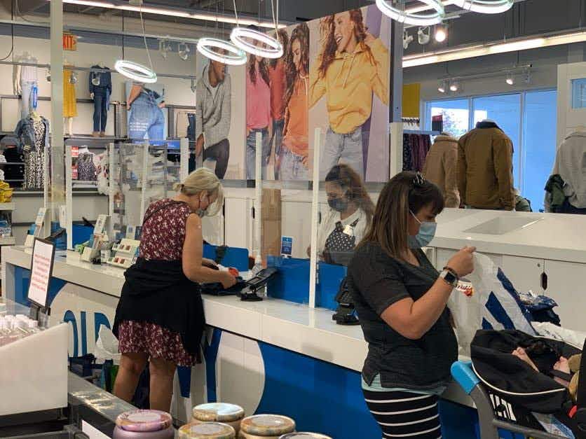 Woman checking out at the check out counter at Old Navy