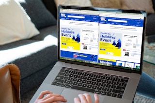 Two web web browsers open to BestBuy.com on a laptop computer