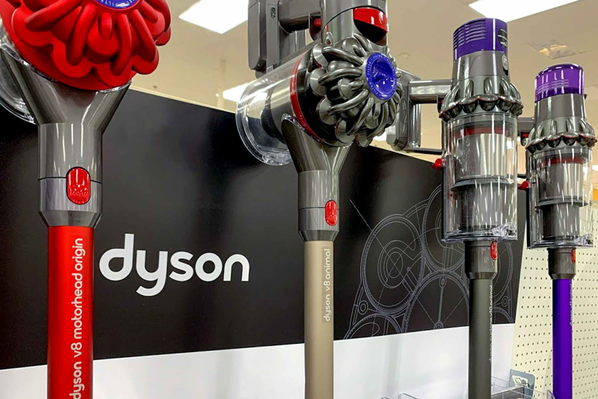 A close up on some Dyson vacuums on a store display