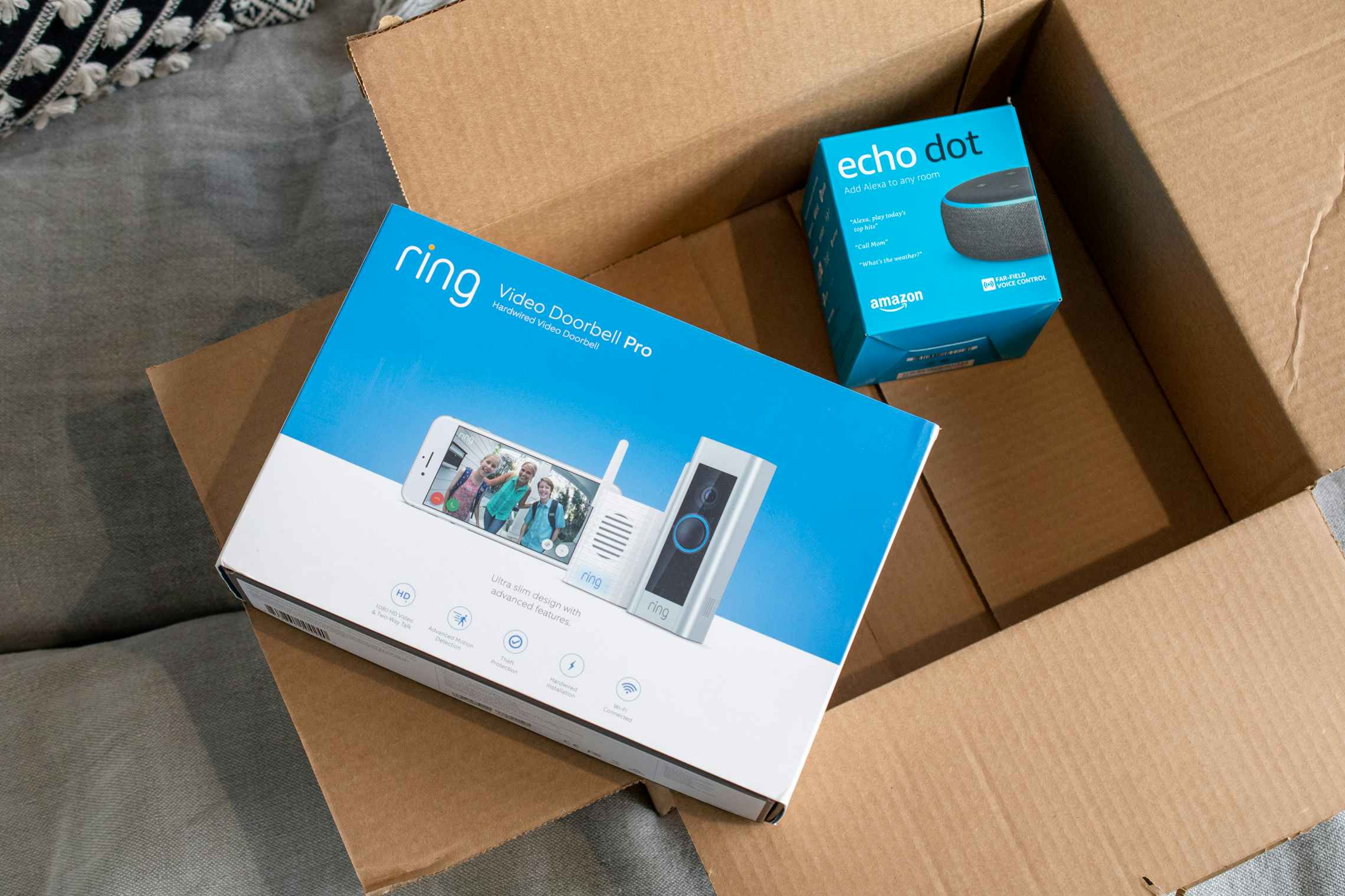 ring doorbell and echo dot outside amazon box 