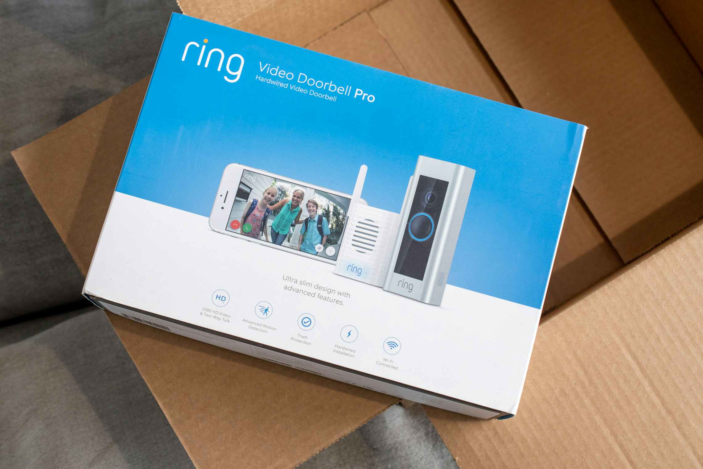 a ring video doorbell pro sitting ontop of an Amazon box