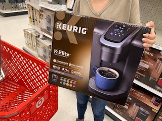 someone holding a keurig k elite at Target