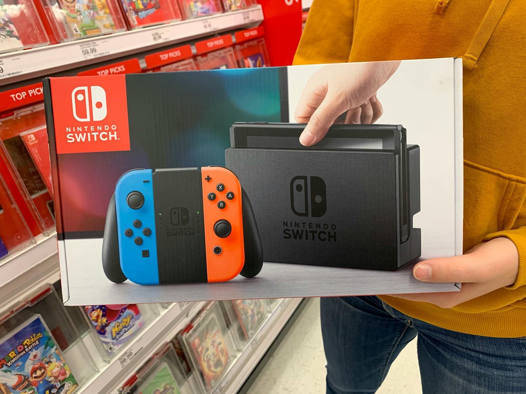 someone holding nintendo switch at Target
