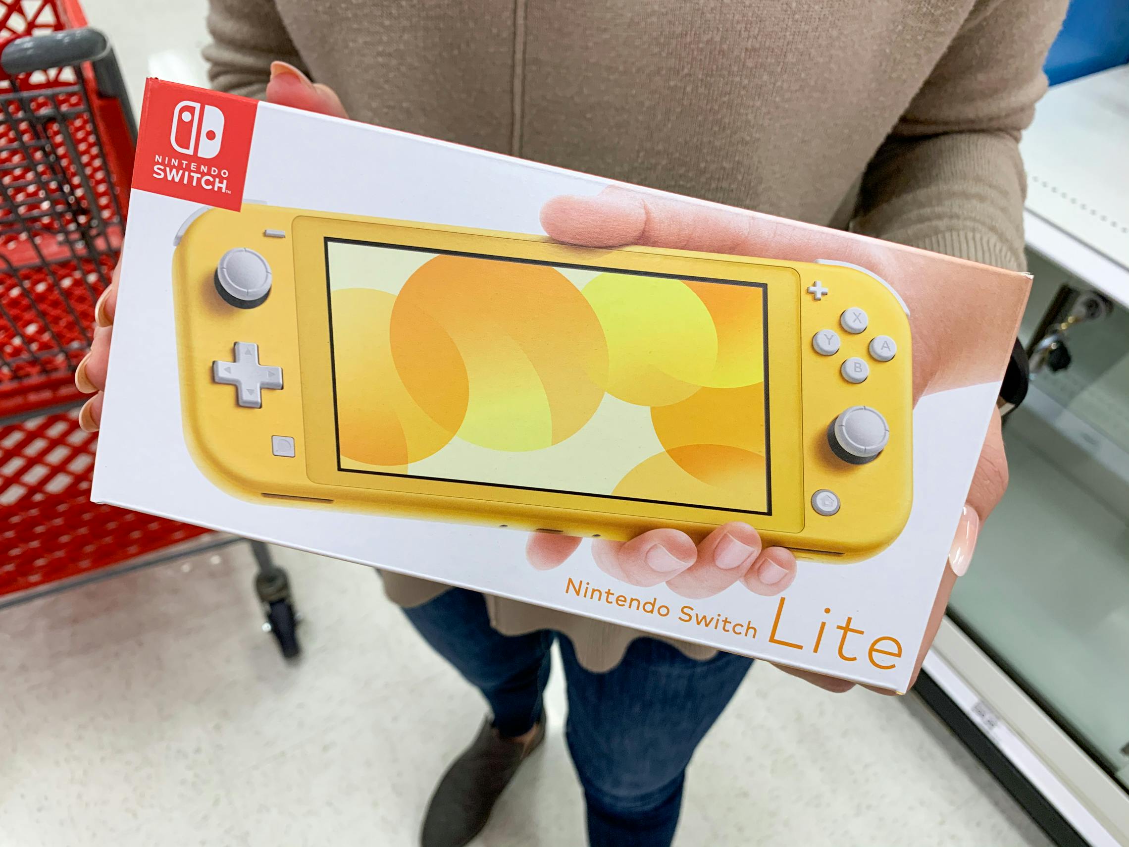 someone holding a nintendo switch at Target